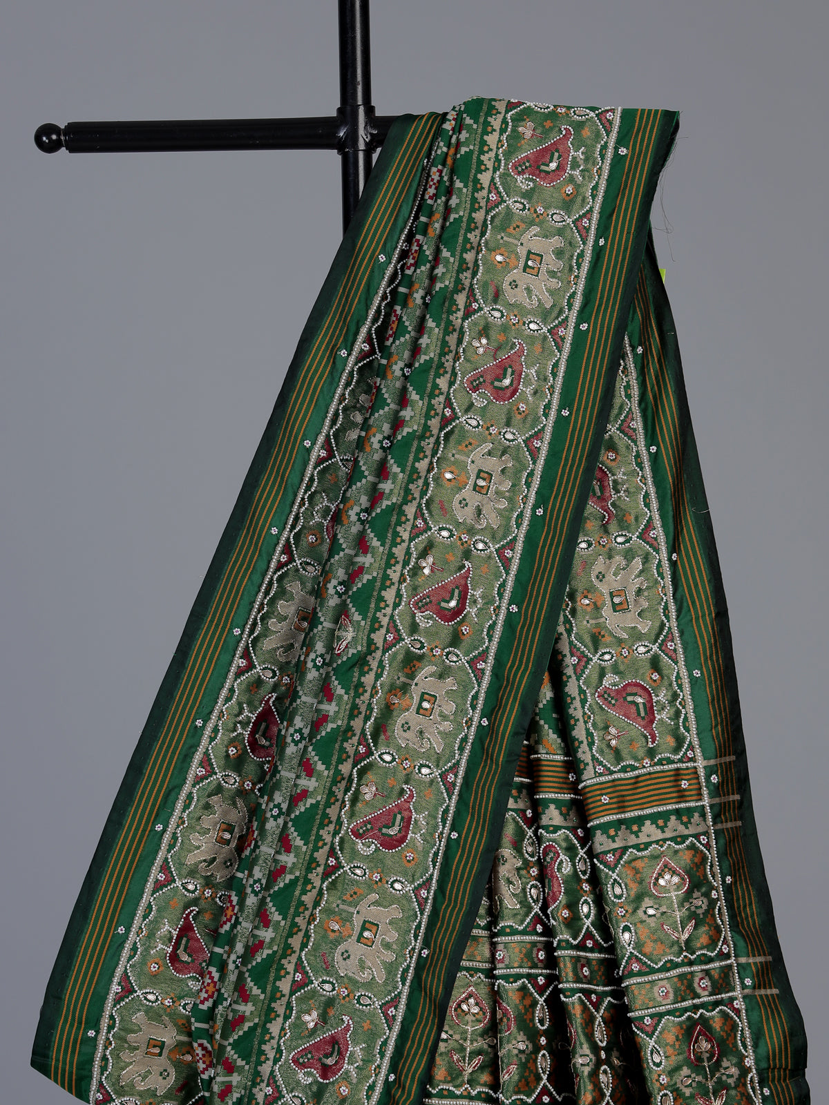 Green art patola silk saree with traditional motif handwork