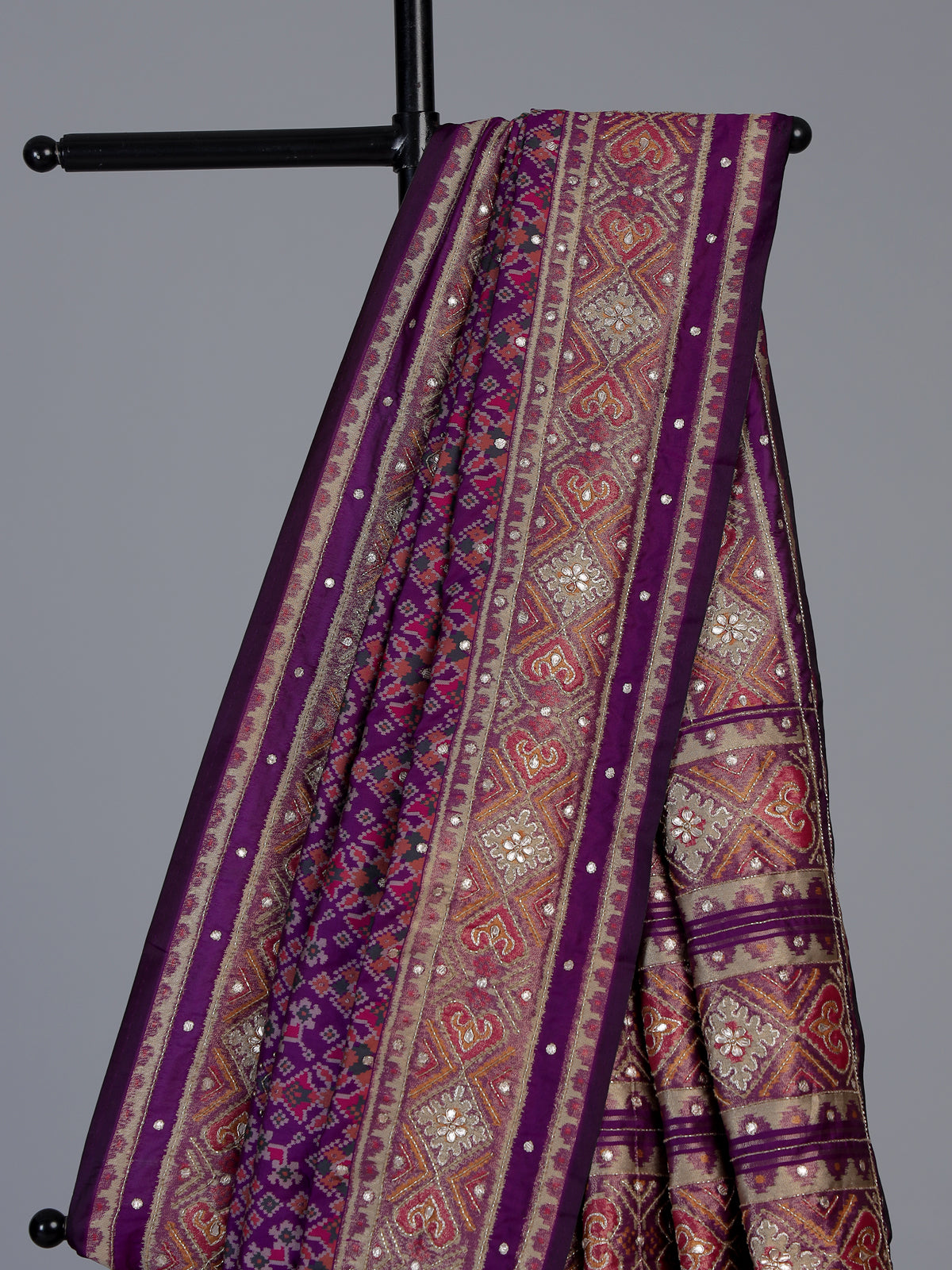Purple art patola silk saree with rich zardosi detailing