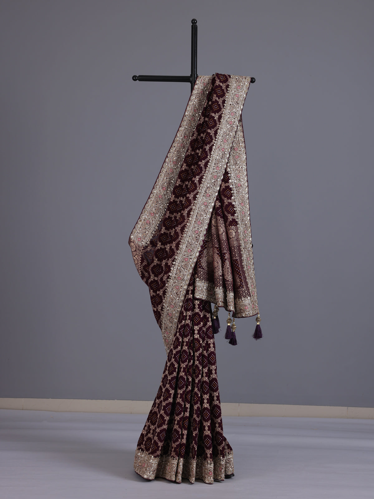 Wine bandhani semi georgette saree with elegant tassel pallu detailing