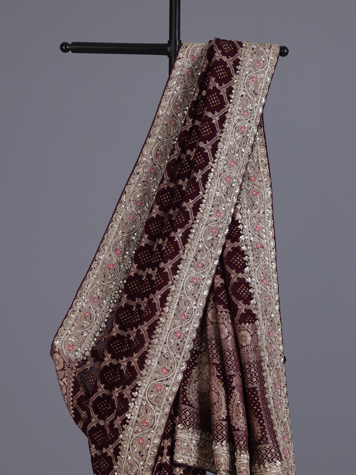 Wine bandhani semi georgette saree with elegant tassel pallu detailing