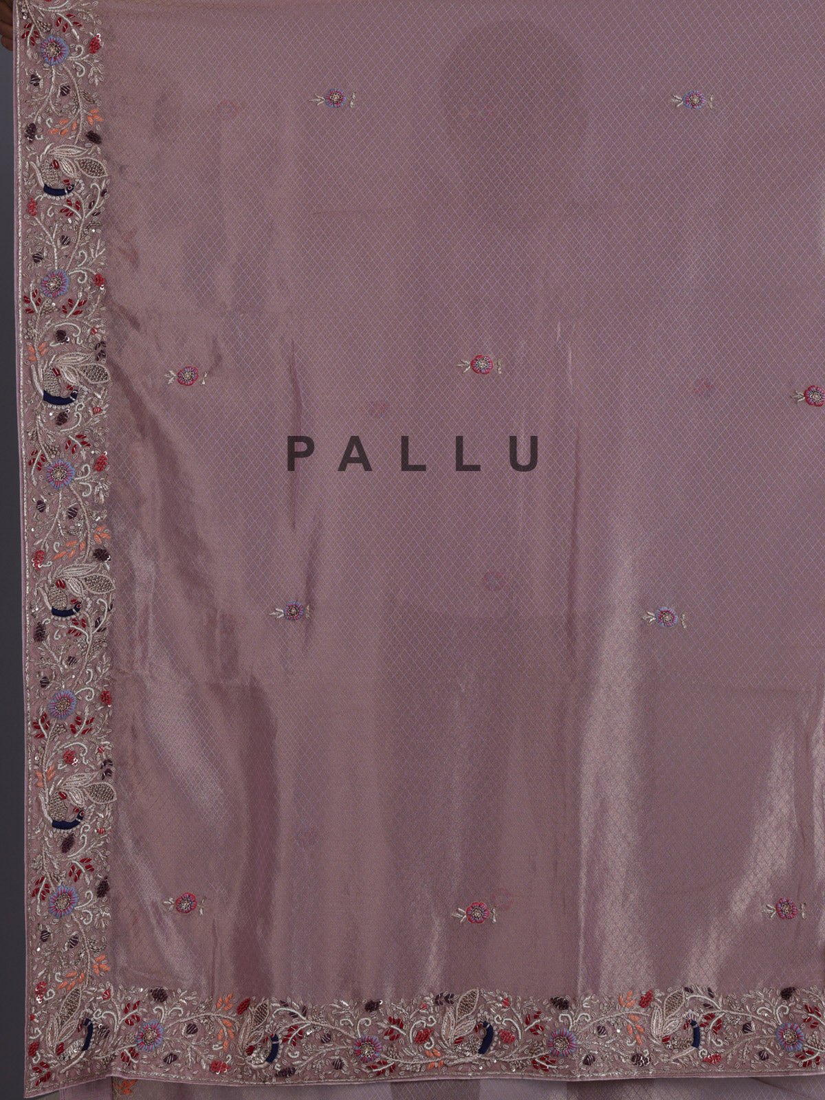 Pastel pink shimmer tissue saree with peacock border designer elegance