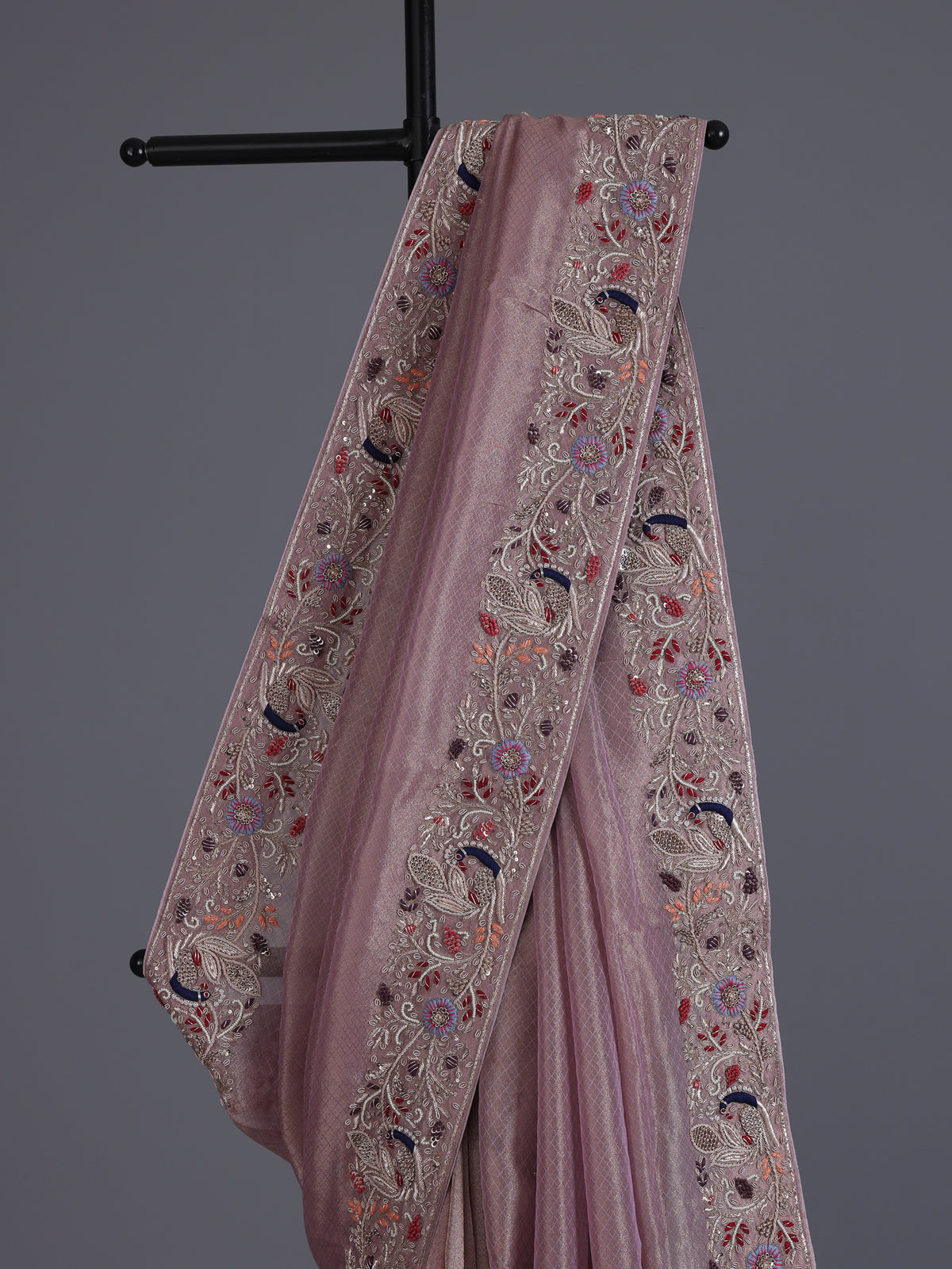 Pastel pink shimmer tissue saree with peacock border designer elegance