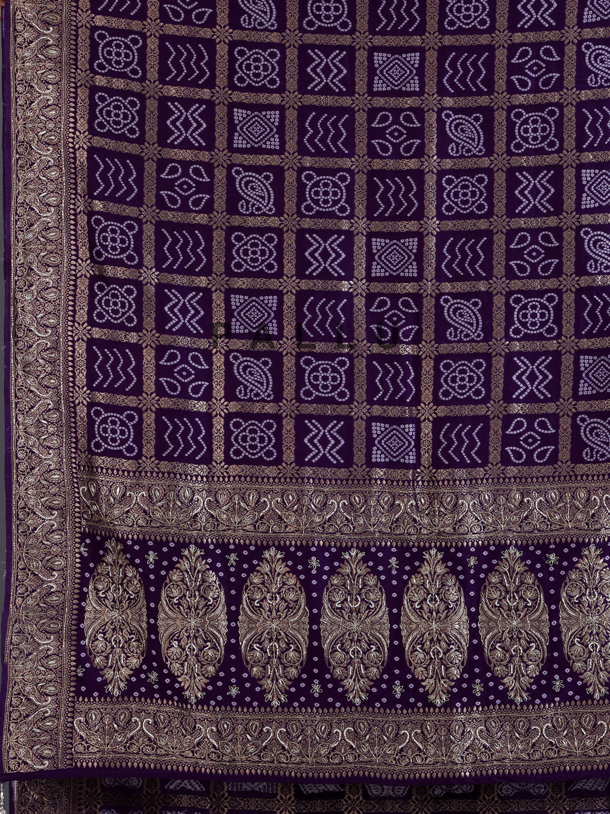 Purple dola silk bandhani saree with luxurious tassel pallu detailing