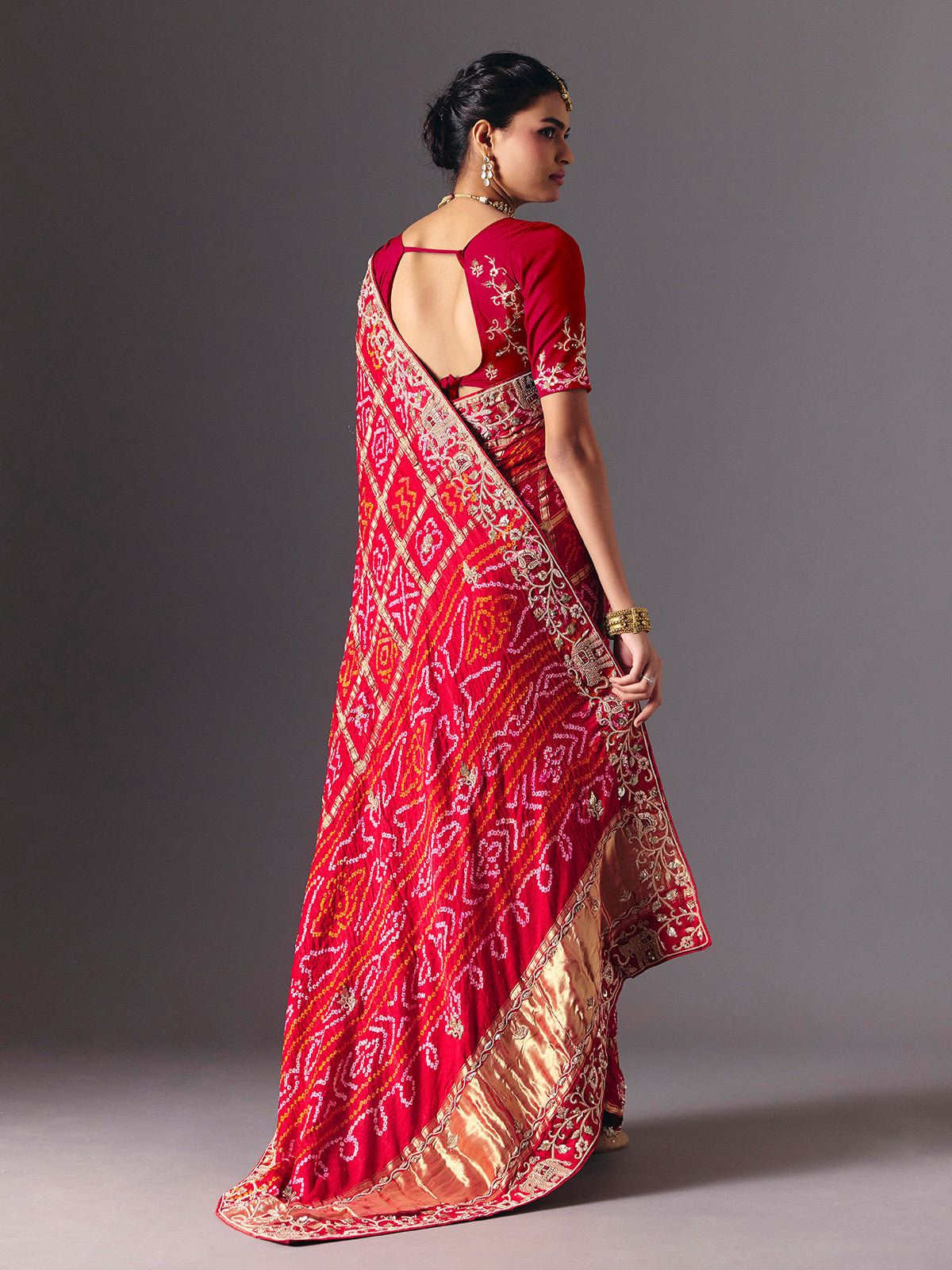 Red traditional bandhani silk bridal saree with elegance
