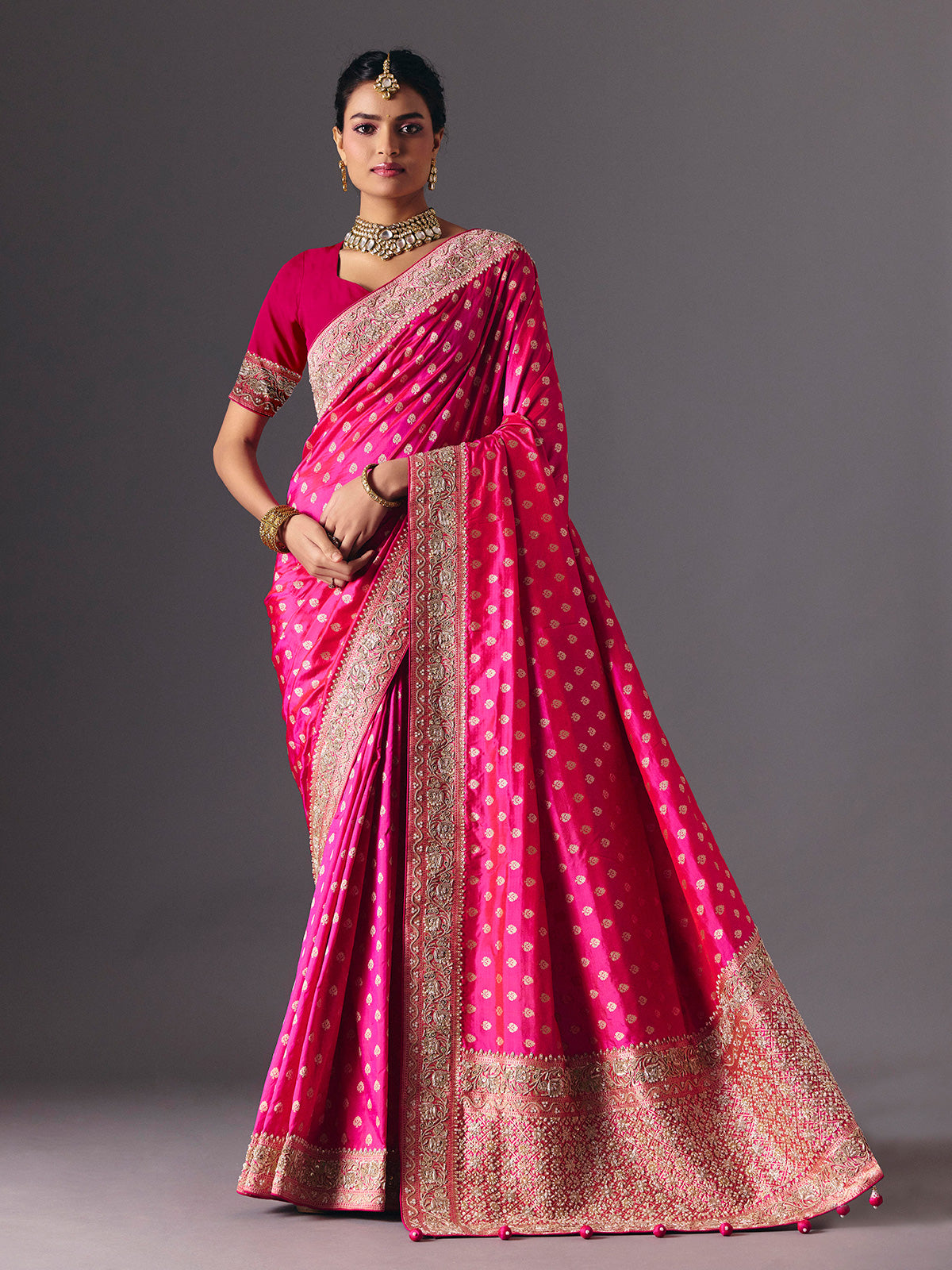 Rani pink banarasi silk saree with butti work and tassels