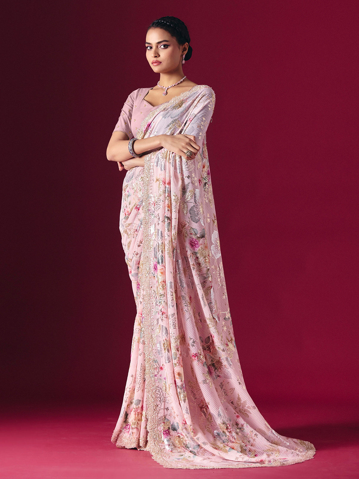 Dusty pink printed georgette saree with elegant embellished festive detailing