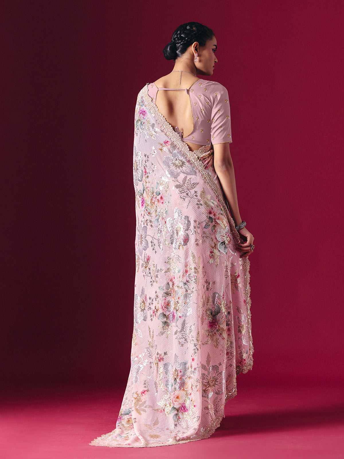 Dusty pink printed georgette saree with elegant embellished festive detailing
