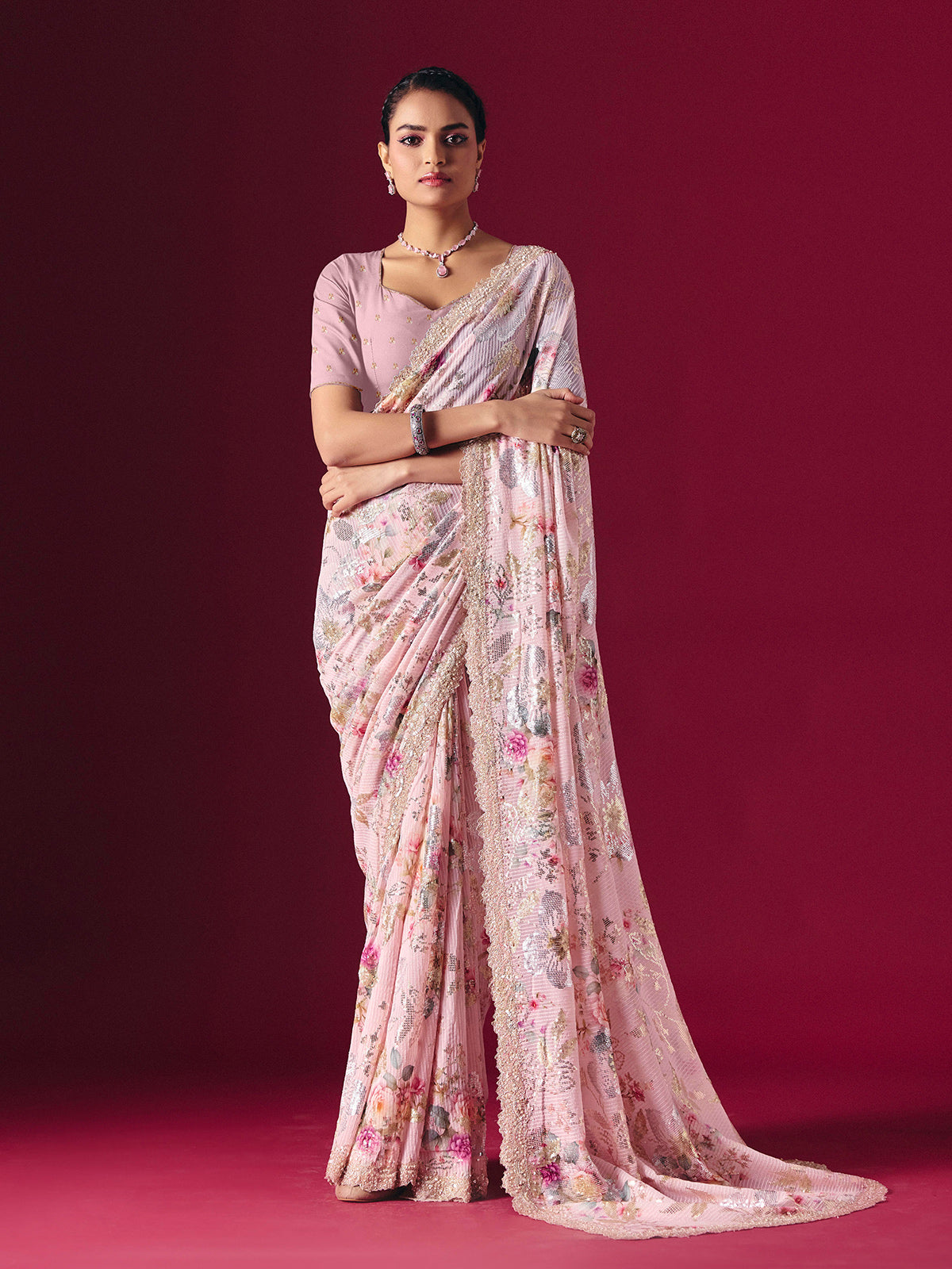 Dusty pink printed georgette saree with elegant embellished festive detailing