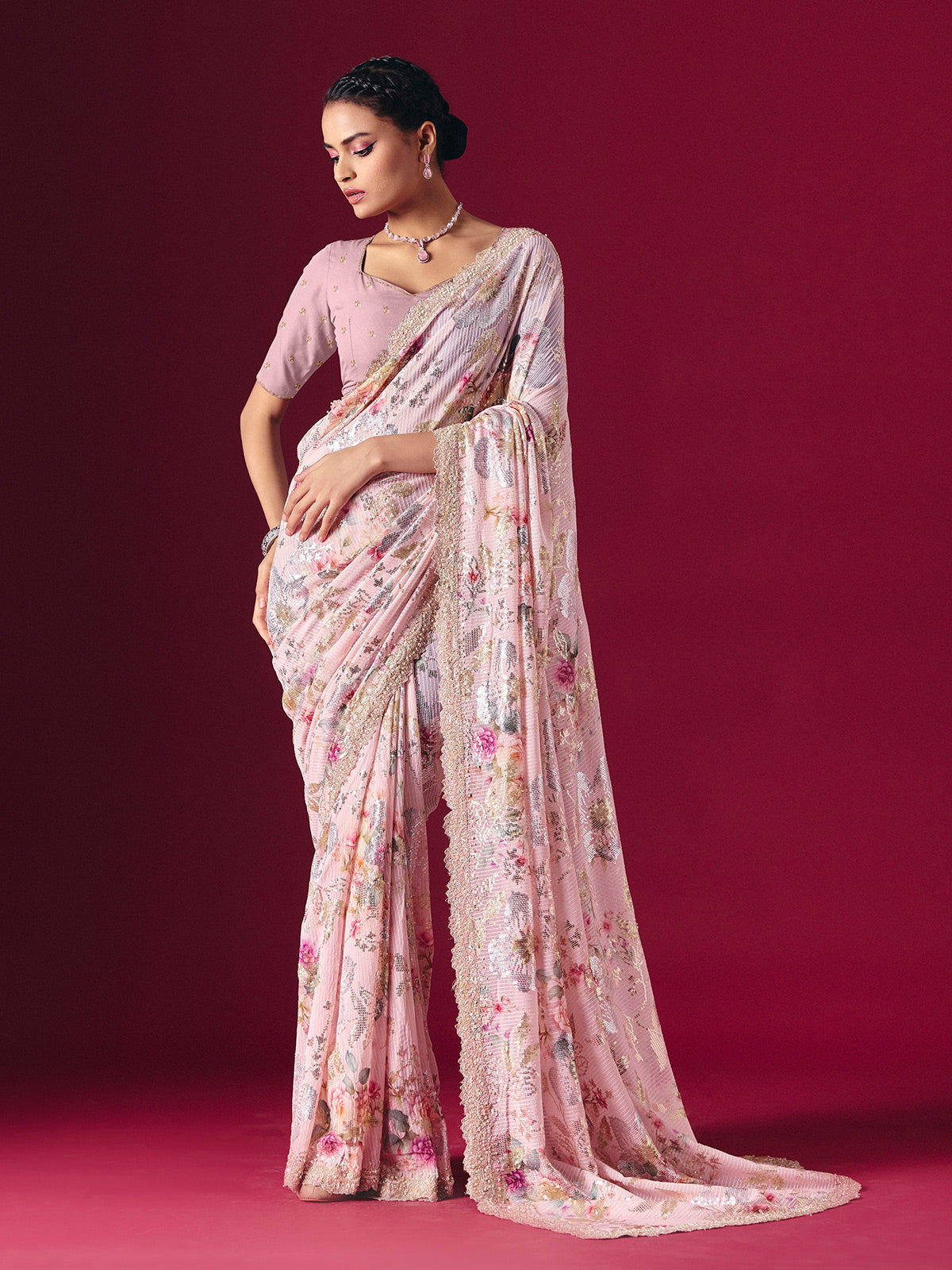 Dusty pink printed georgette saree with elegant embellished festive detailing