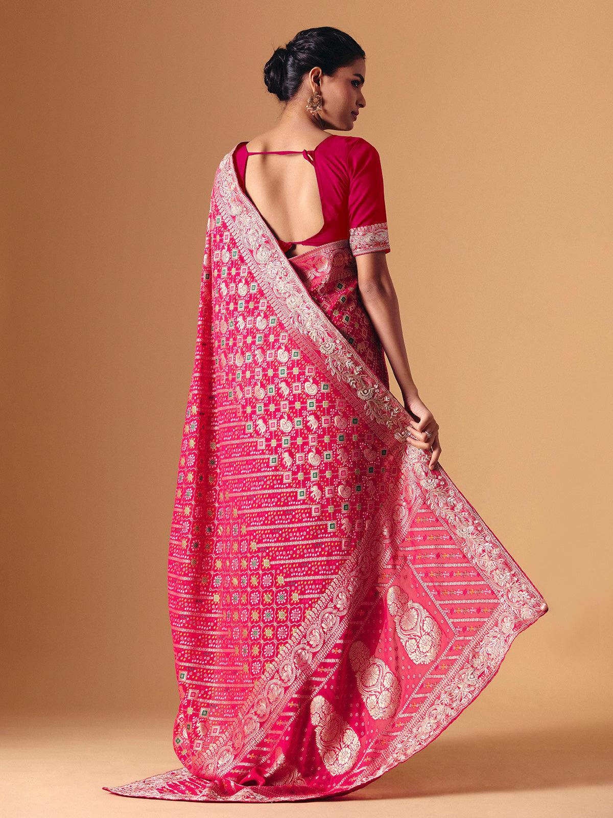 Deep pink georgette bridal saree with zardosi embellished elegance