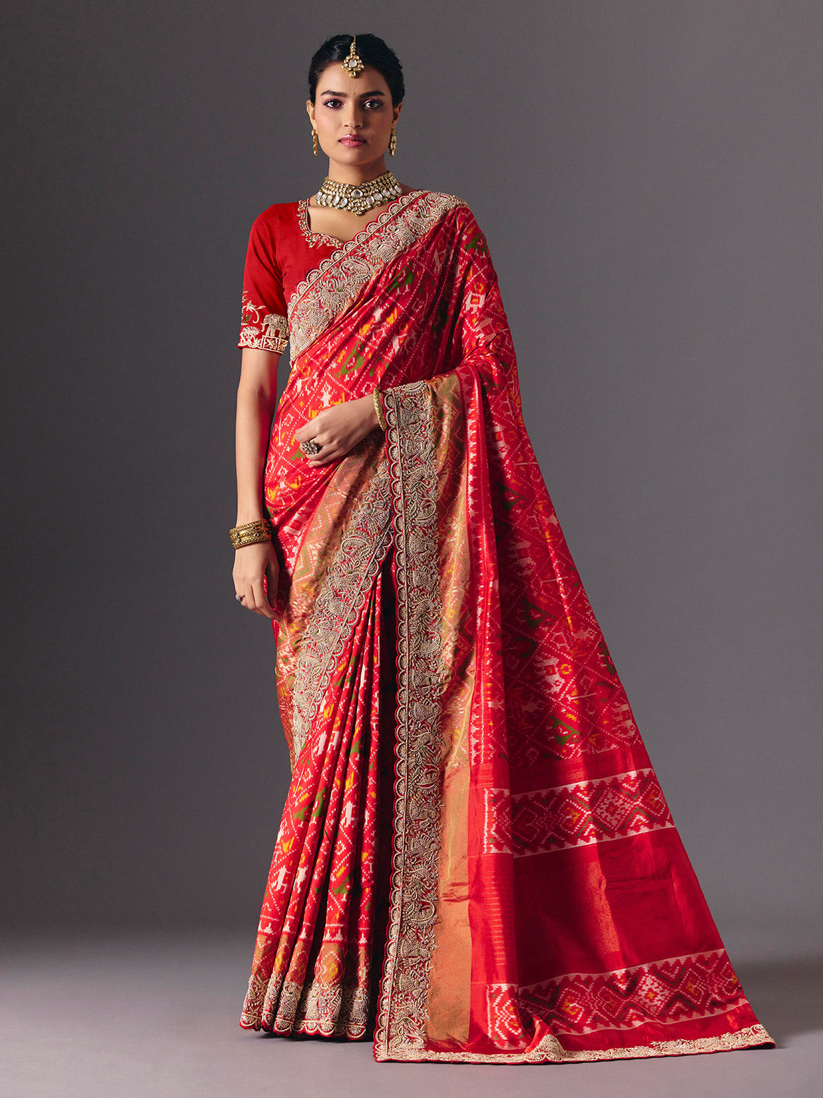 Red Hyderabadi patola silk saree with luxurious printed bridal artistry