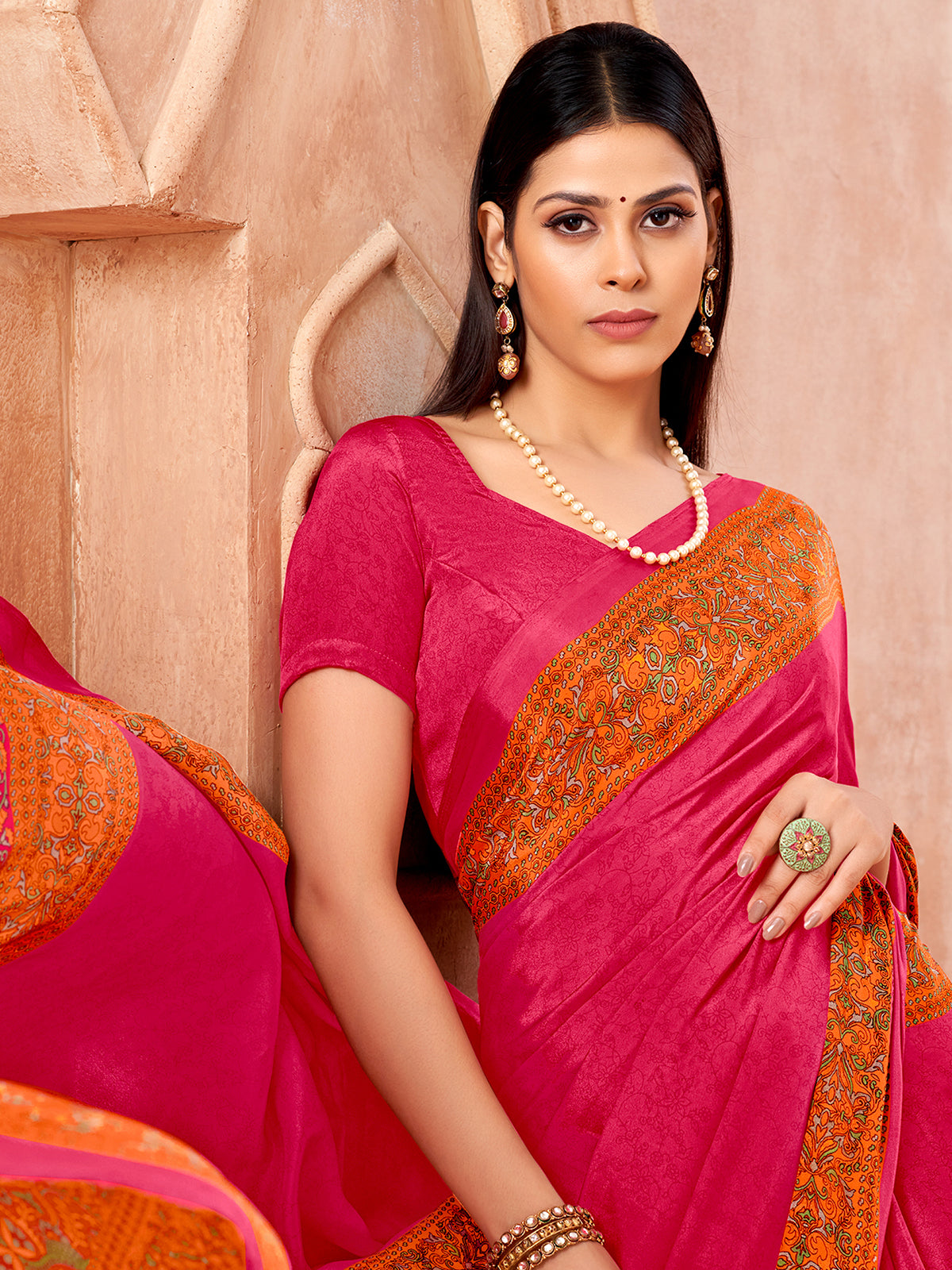 Rani pink printed contrast border and pallu crepe silk saree