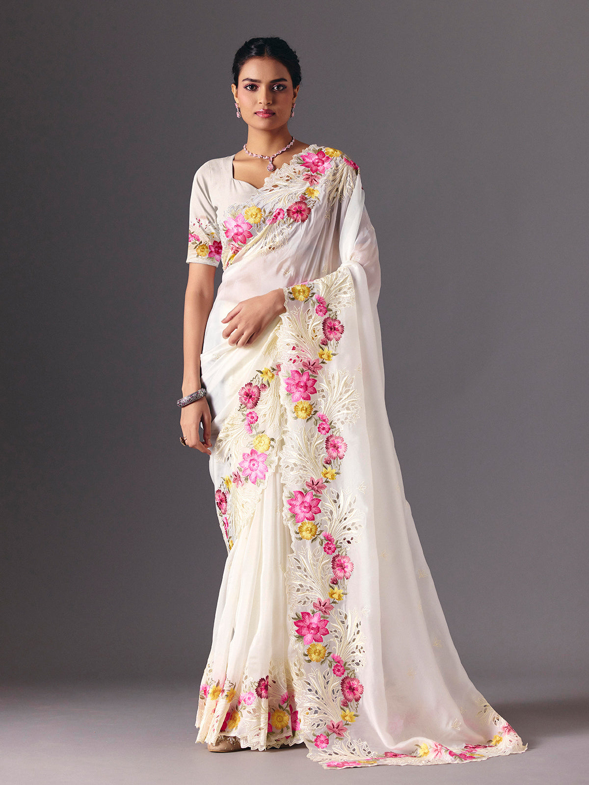 White organza floral embroidered saree with elegant cutwork detailing