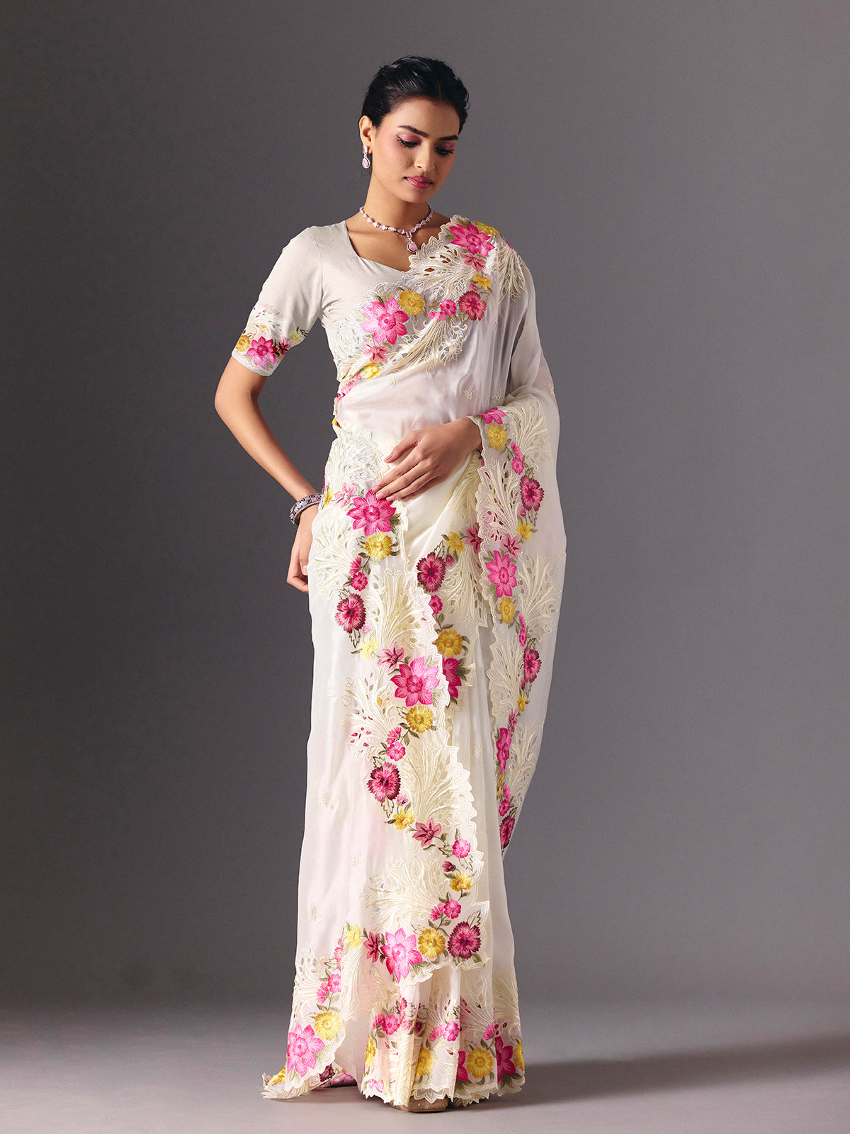 White organza floral embroidered saree with elegant cutwork detailing