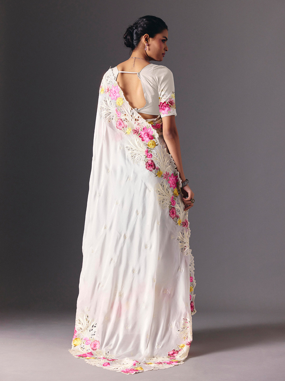 White organza floral embroidered saree with elegant cutwork detailing
