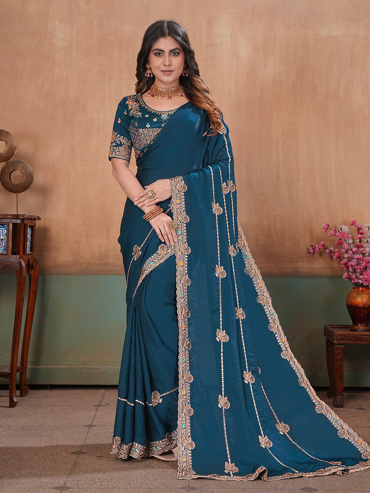 Peacock blue radiant embroidered satin saree with blouse