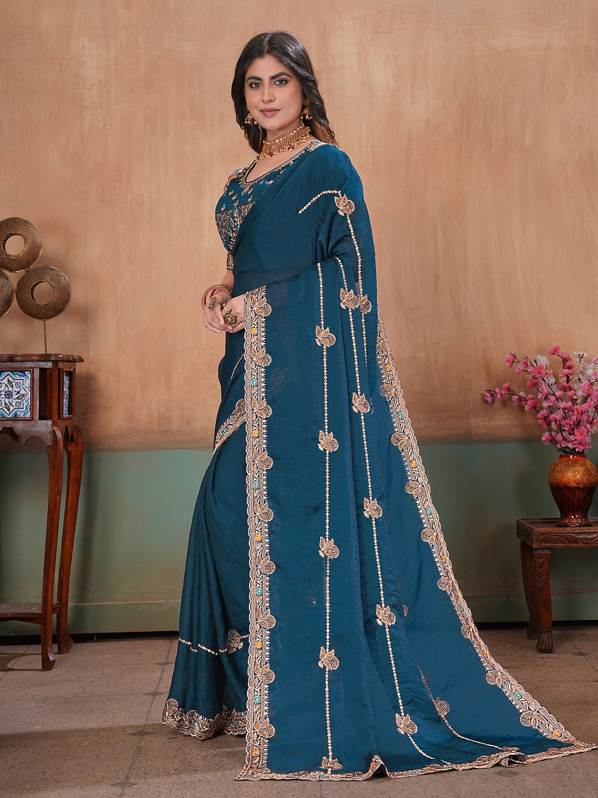 Peacock blue radiant embroidered satin saree with blouse
