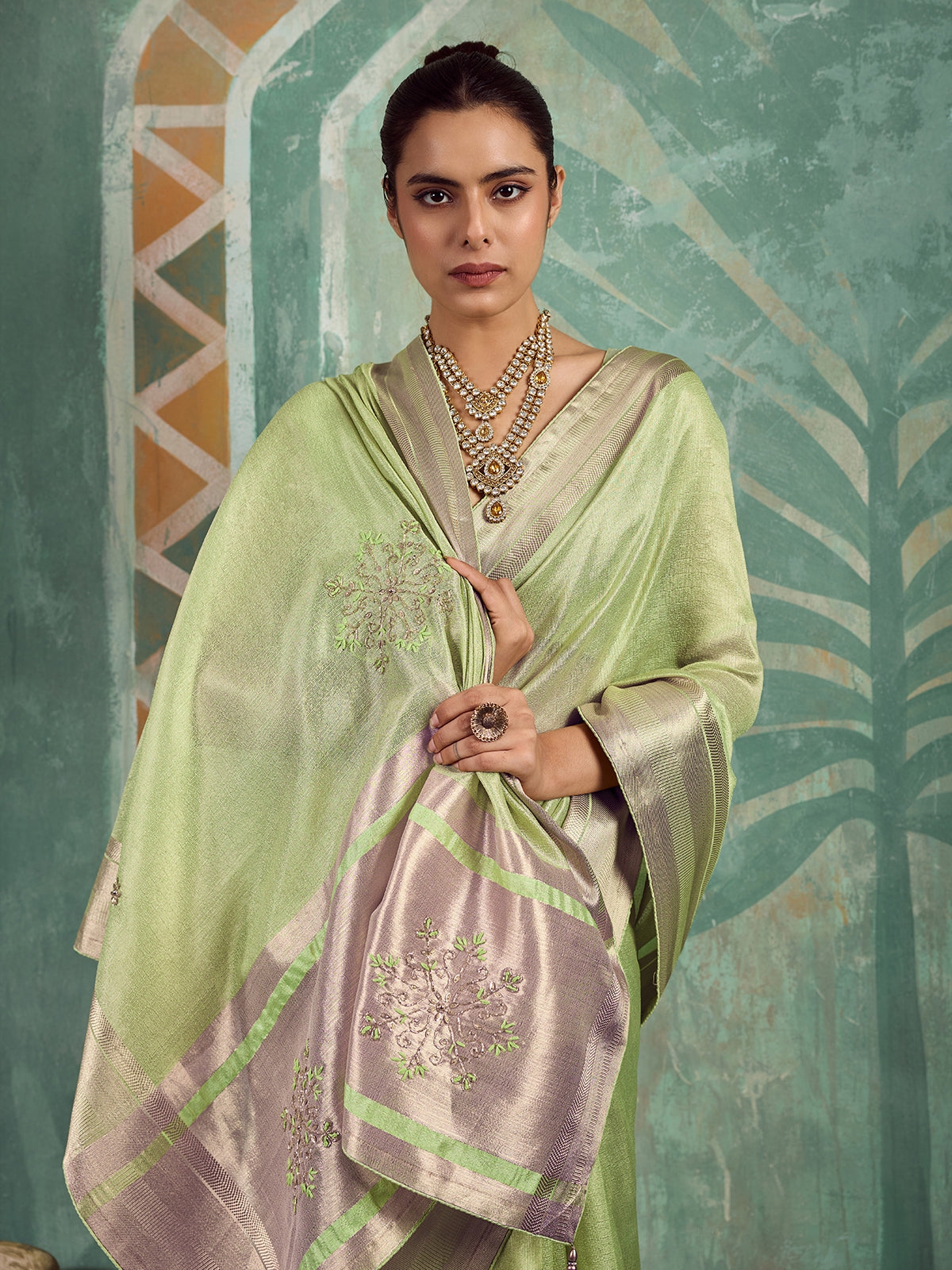 Enchanting green embroidered tissue saree for women