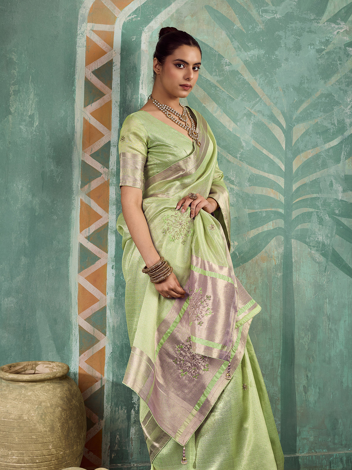 Enchanting green embroidered tissue saree for women