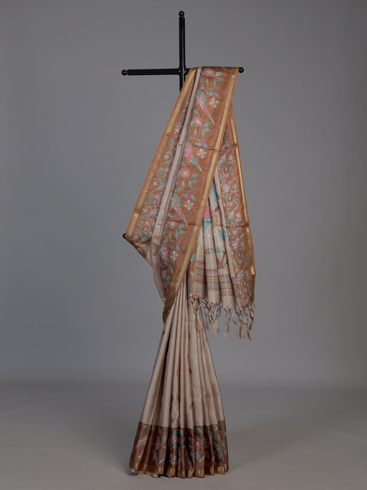Beige and brown art tusser silk saree with floral bird detailing