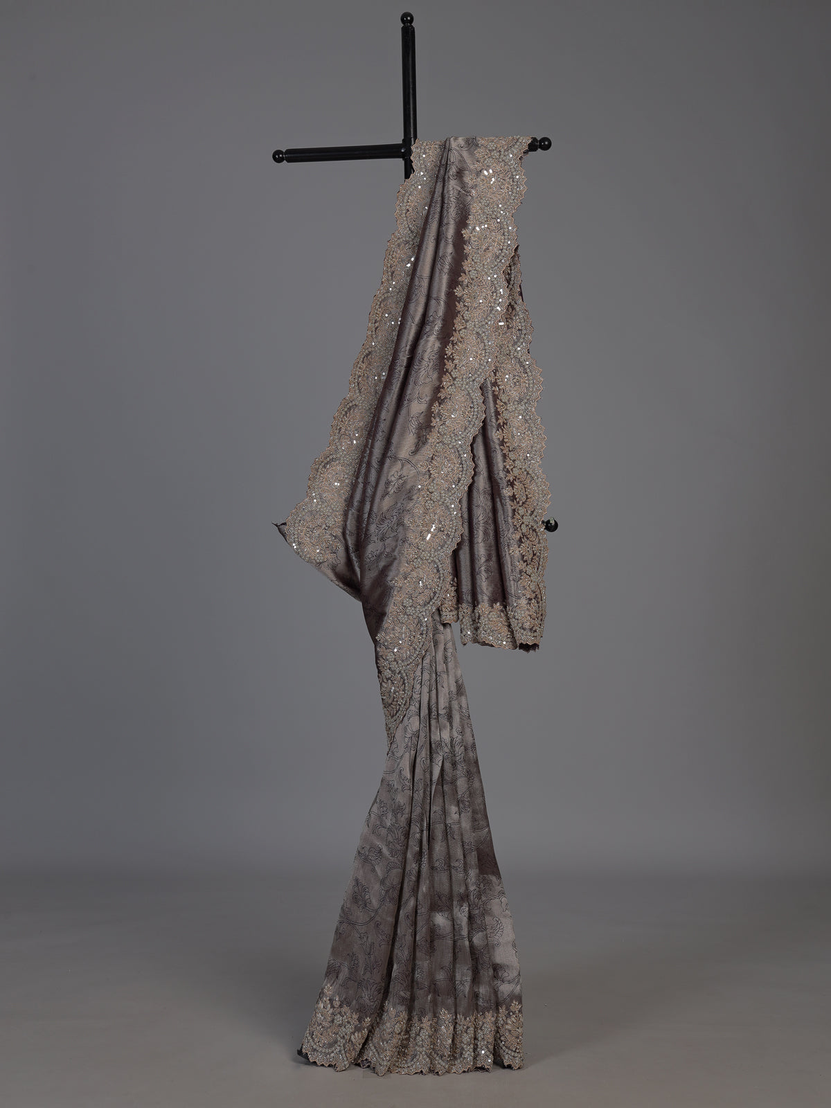 Pastel grey tissue silk saree with delicate pearl zari embellishments