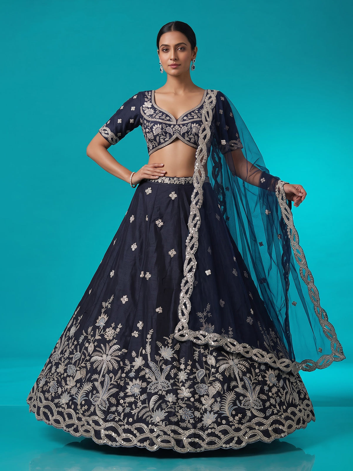 Navy blue silk lehenga choli adorned with floral stonework