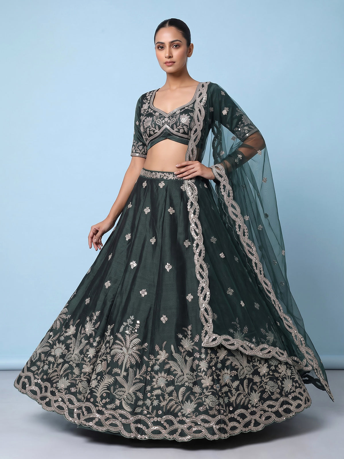 Peacock green silk lehenga choli with floral zardosi embellishments