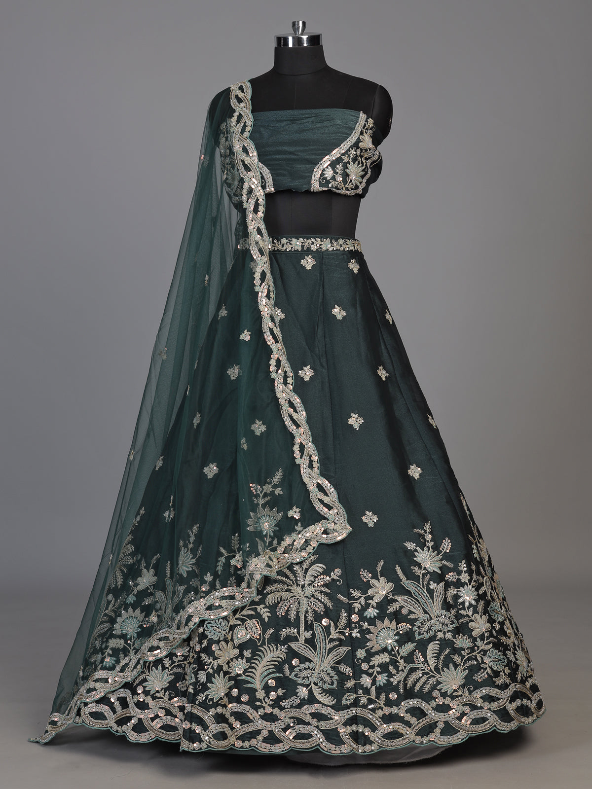Peacock green silk lehenga choli with floral zardosi embellishments