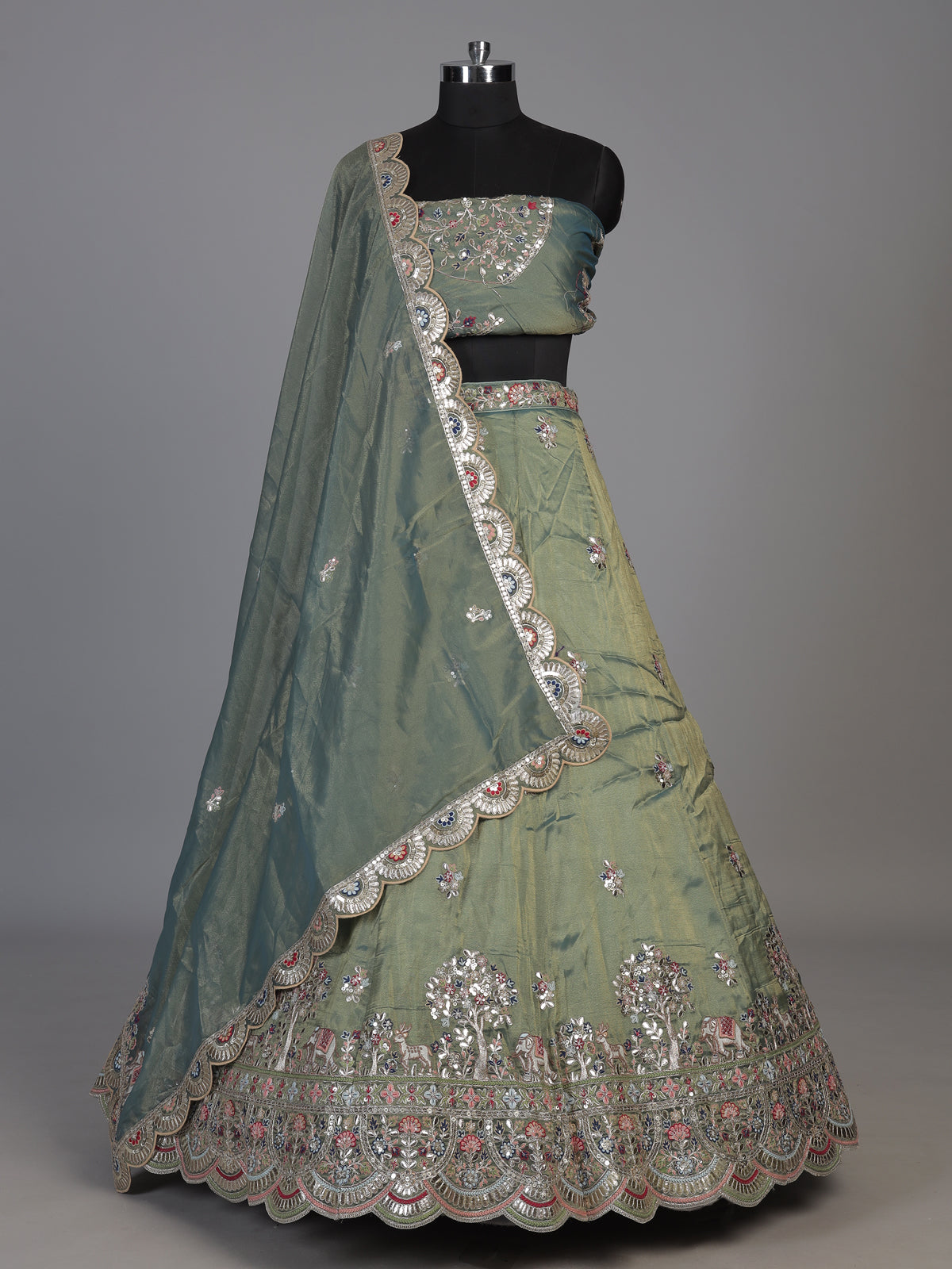 Sage green silk lehenga choli with exquisite animal artistry