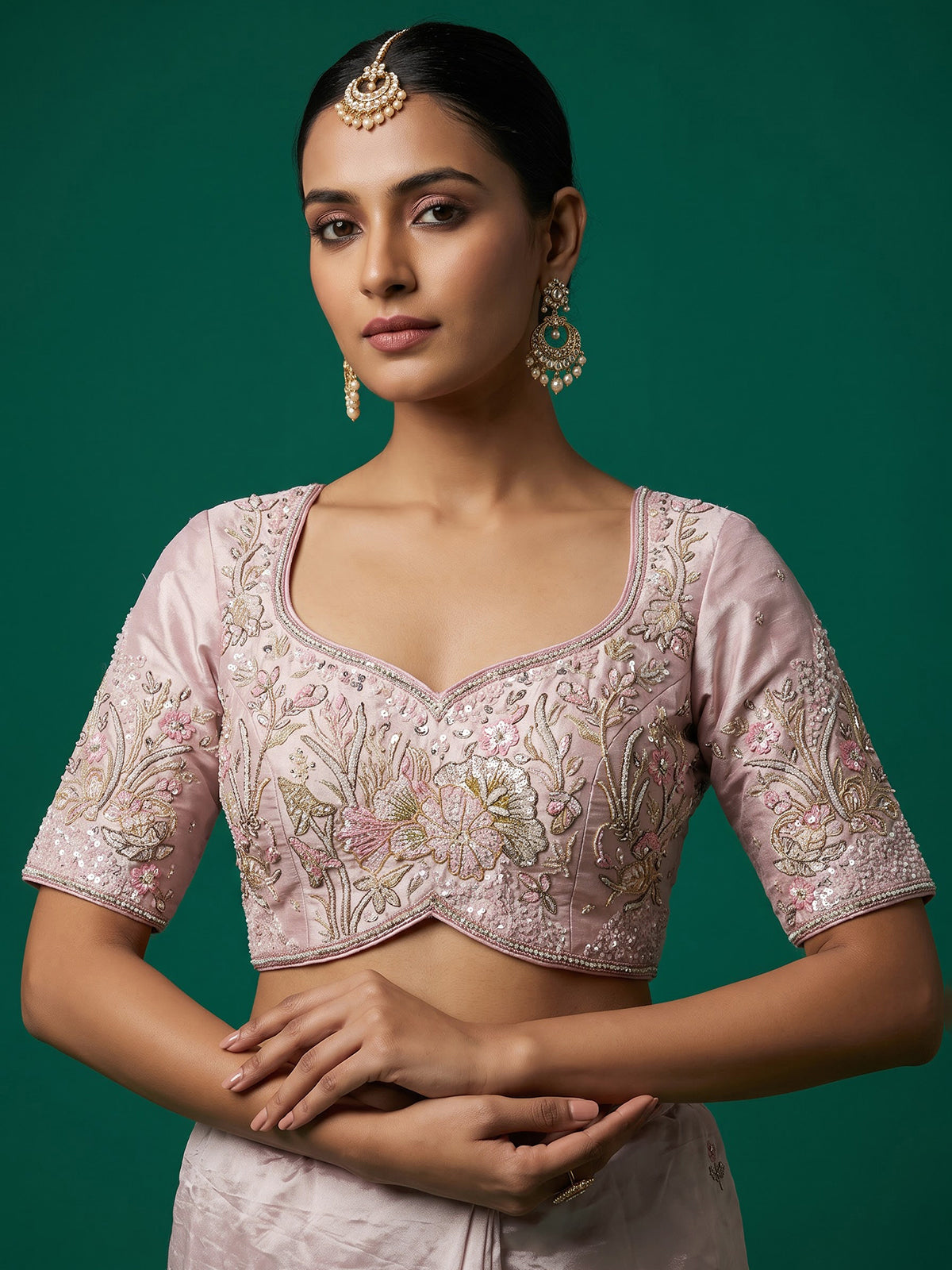 Pink tissue silk lehenga choli adorned with floral bird artistry