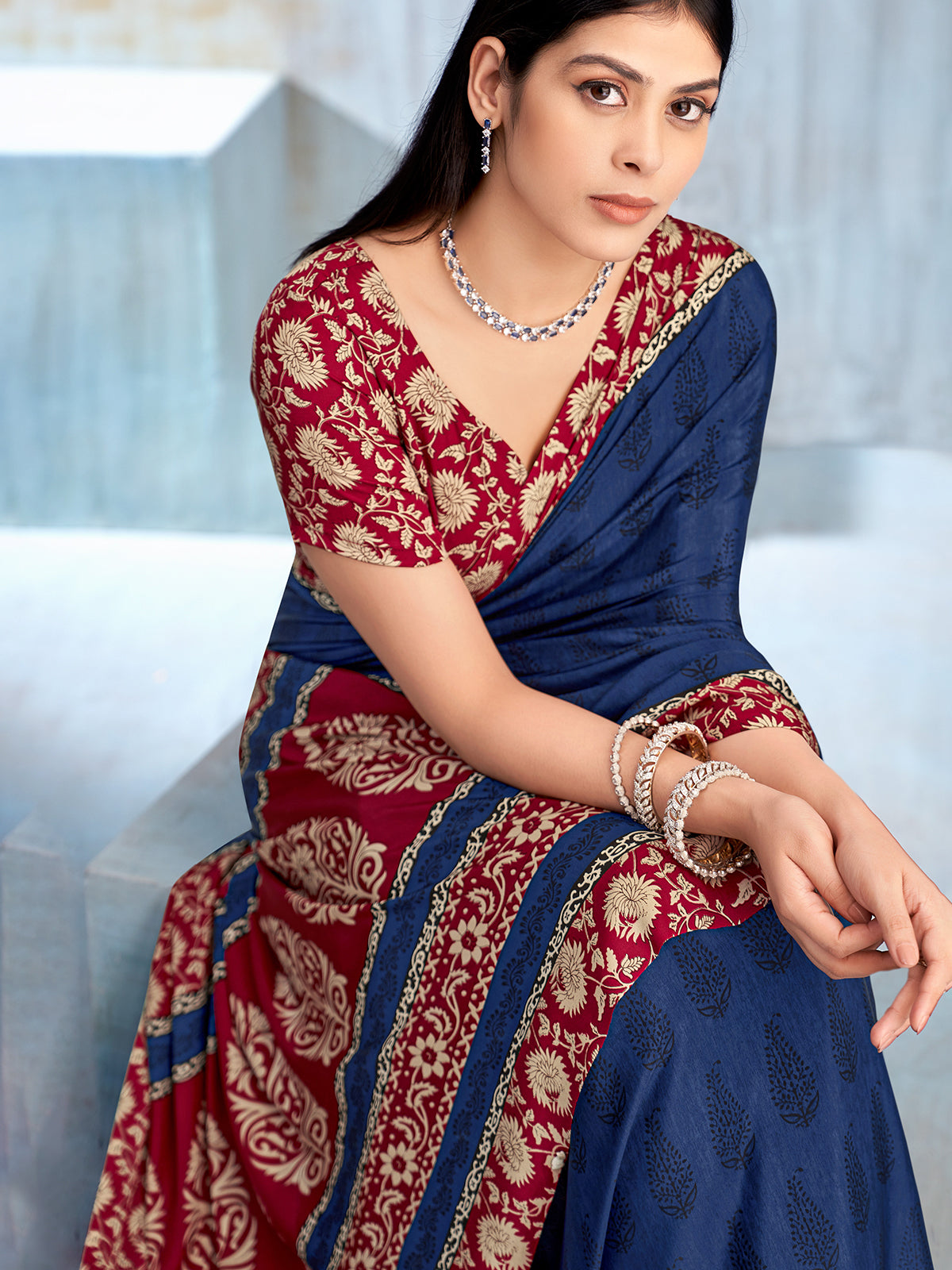 Blue floral printed contrast border and pallu crepe saree