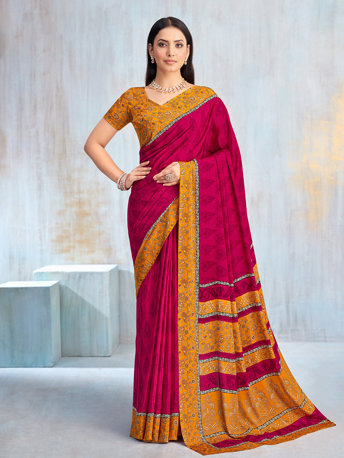 Rani pink floral printed contrast border and pallu saree