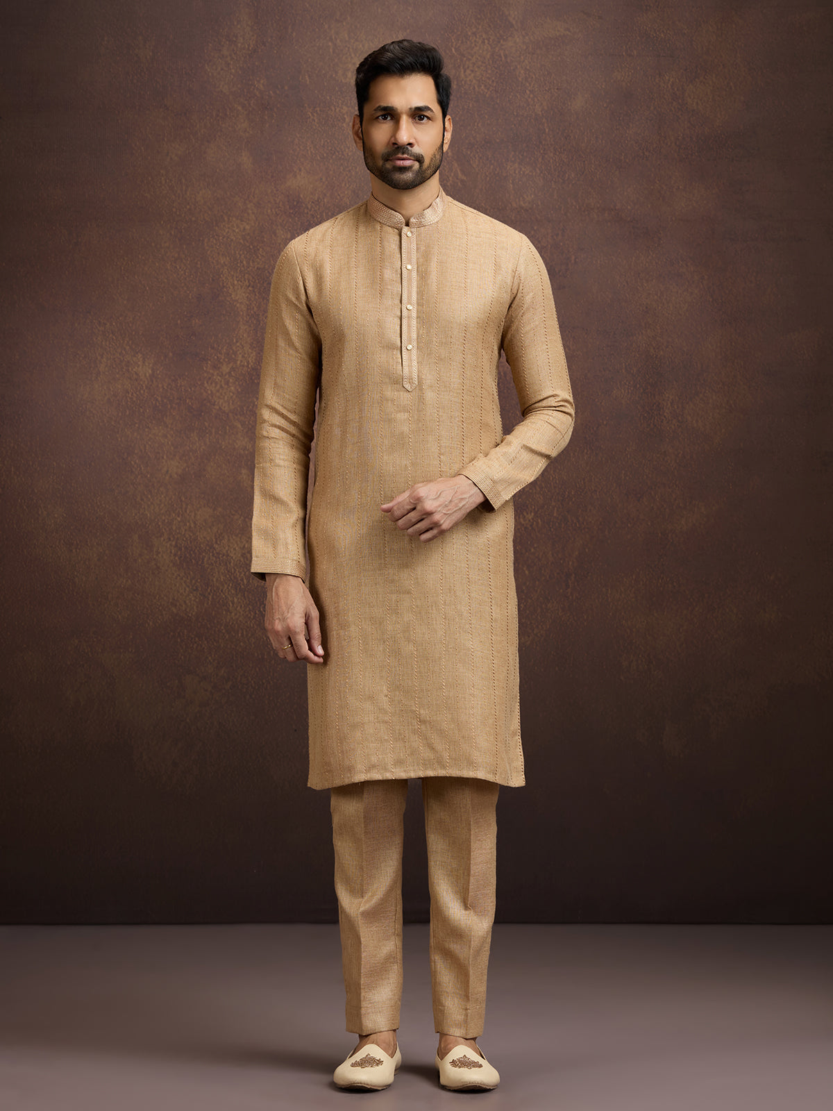 Gold graceful embroidered linen kurta pajama attire