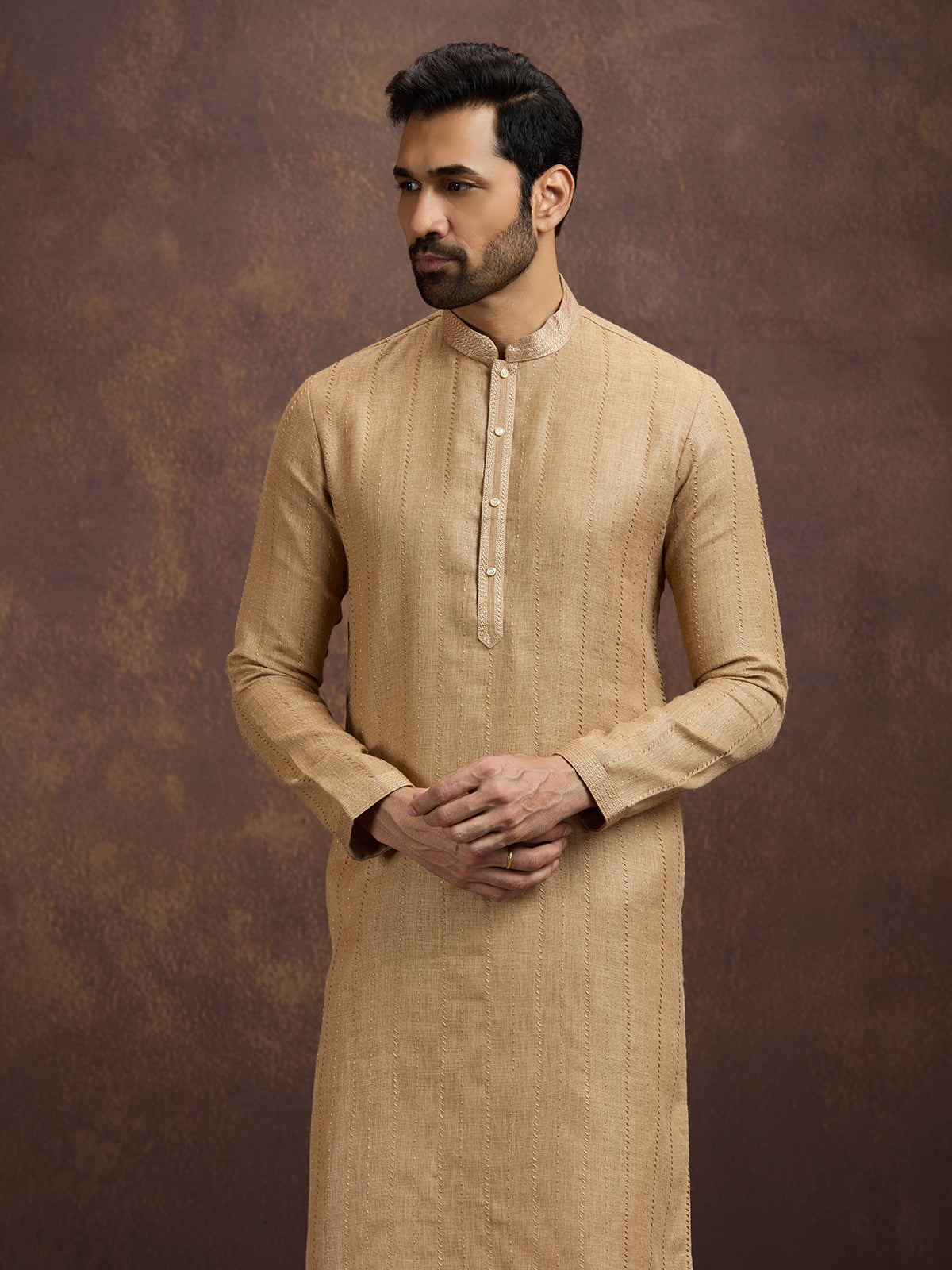 Gold graceful embroidered linen kurta pajama attire