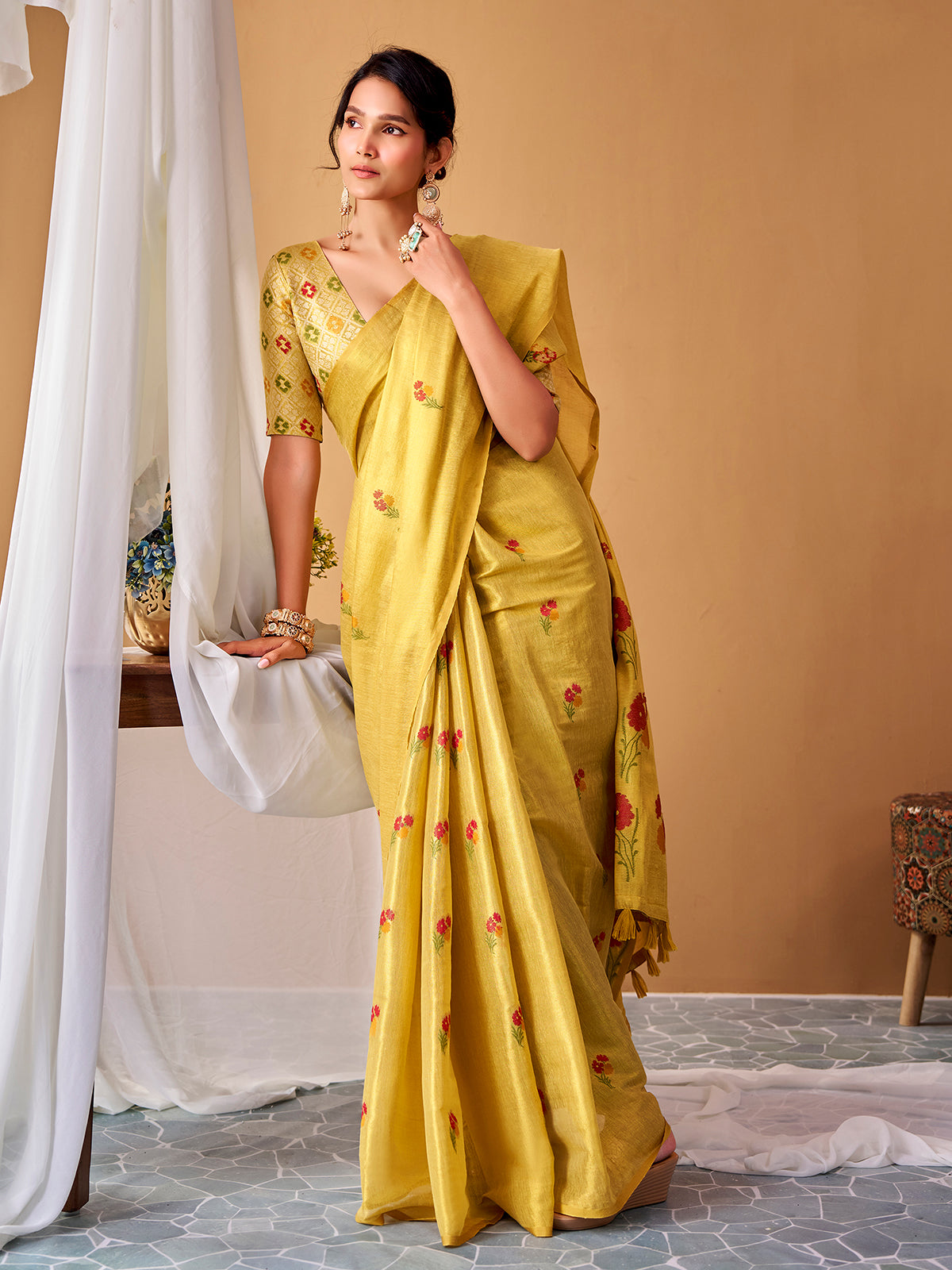 Light yellow graceful tissue silk saree