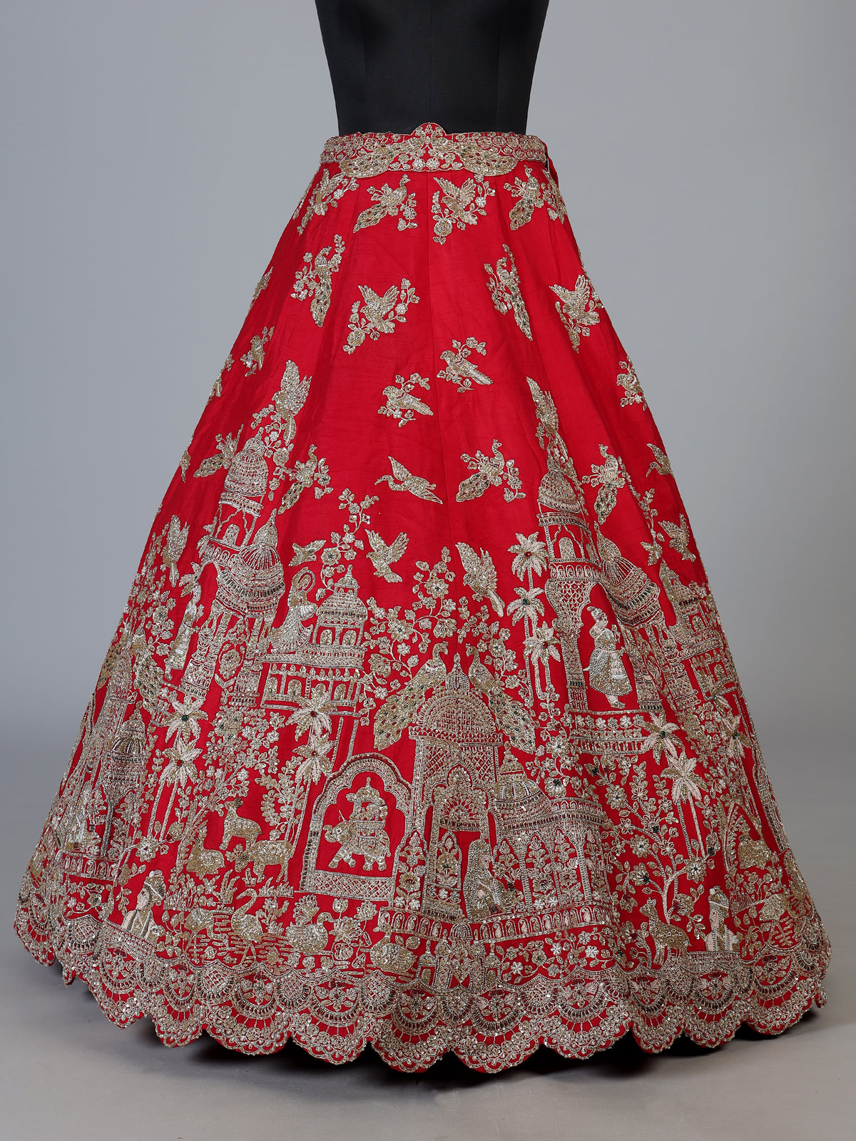 Red raw silk unstitched bridal lehenga choli with artistic motifs