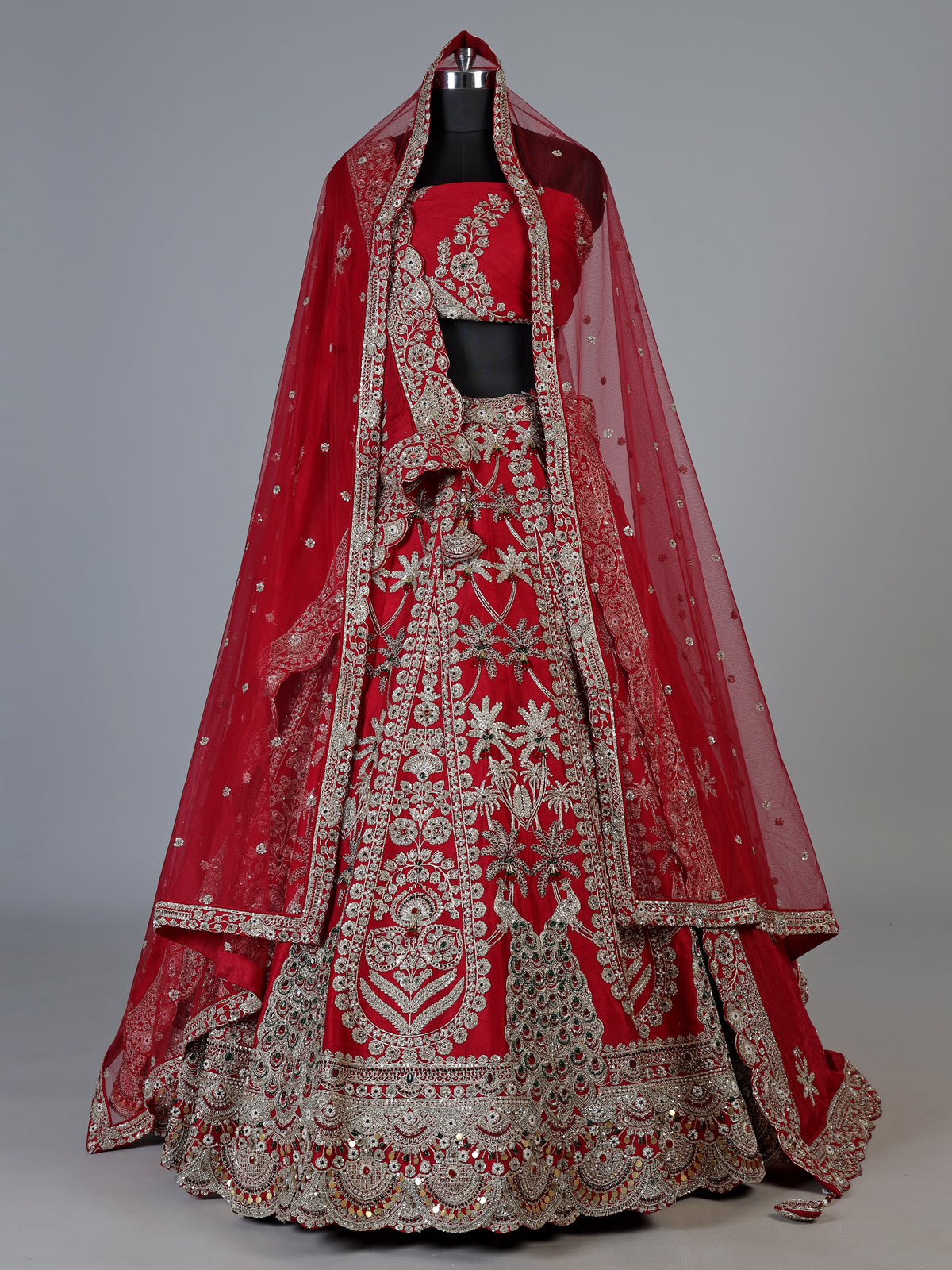 Red raw silk unstitched bridal lehenga choli with peacock artistry