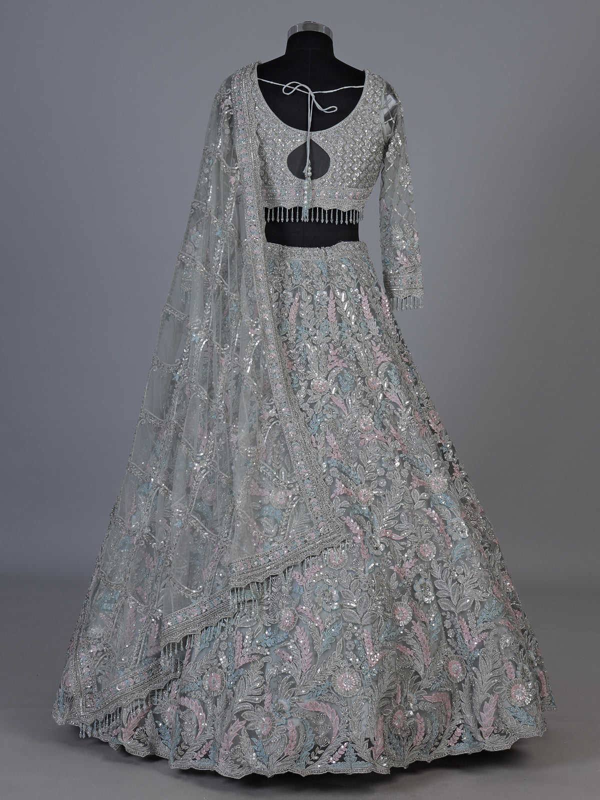 Ice blue net lehenga choli with shimmering diamond embellishments