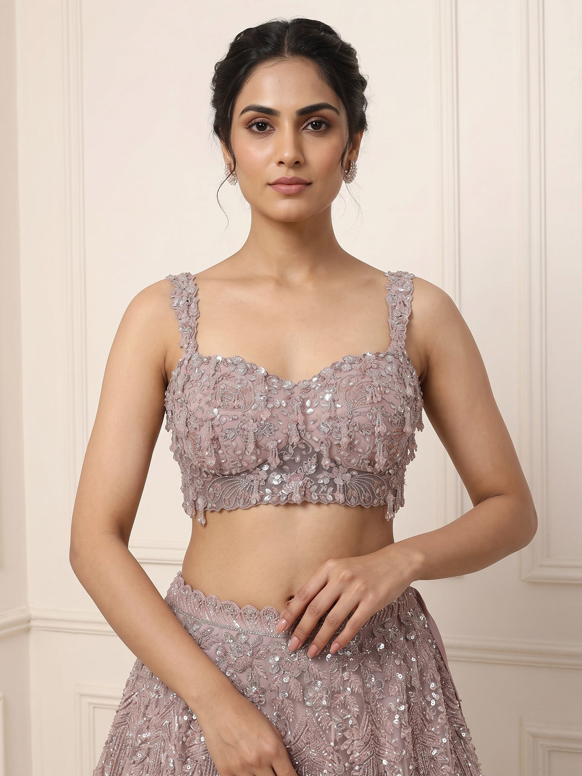 Onion pink net lehenga choli with sparkling heavy embellishments