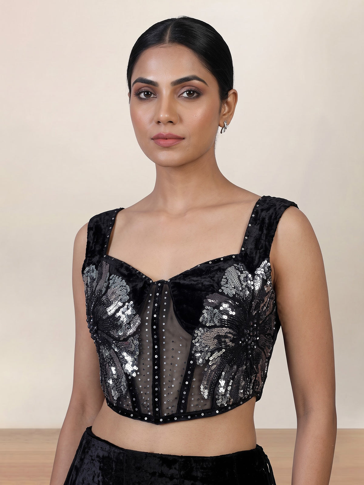 Black velvet lehenga choli with cutdana and pearl embellishments
