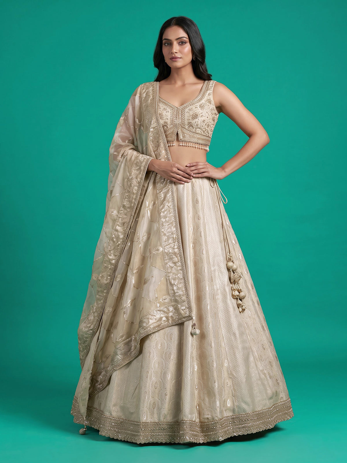 Cream jacquard brocade lehenga choli with lavish embellishments