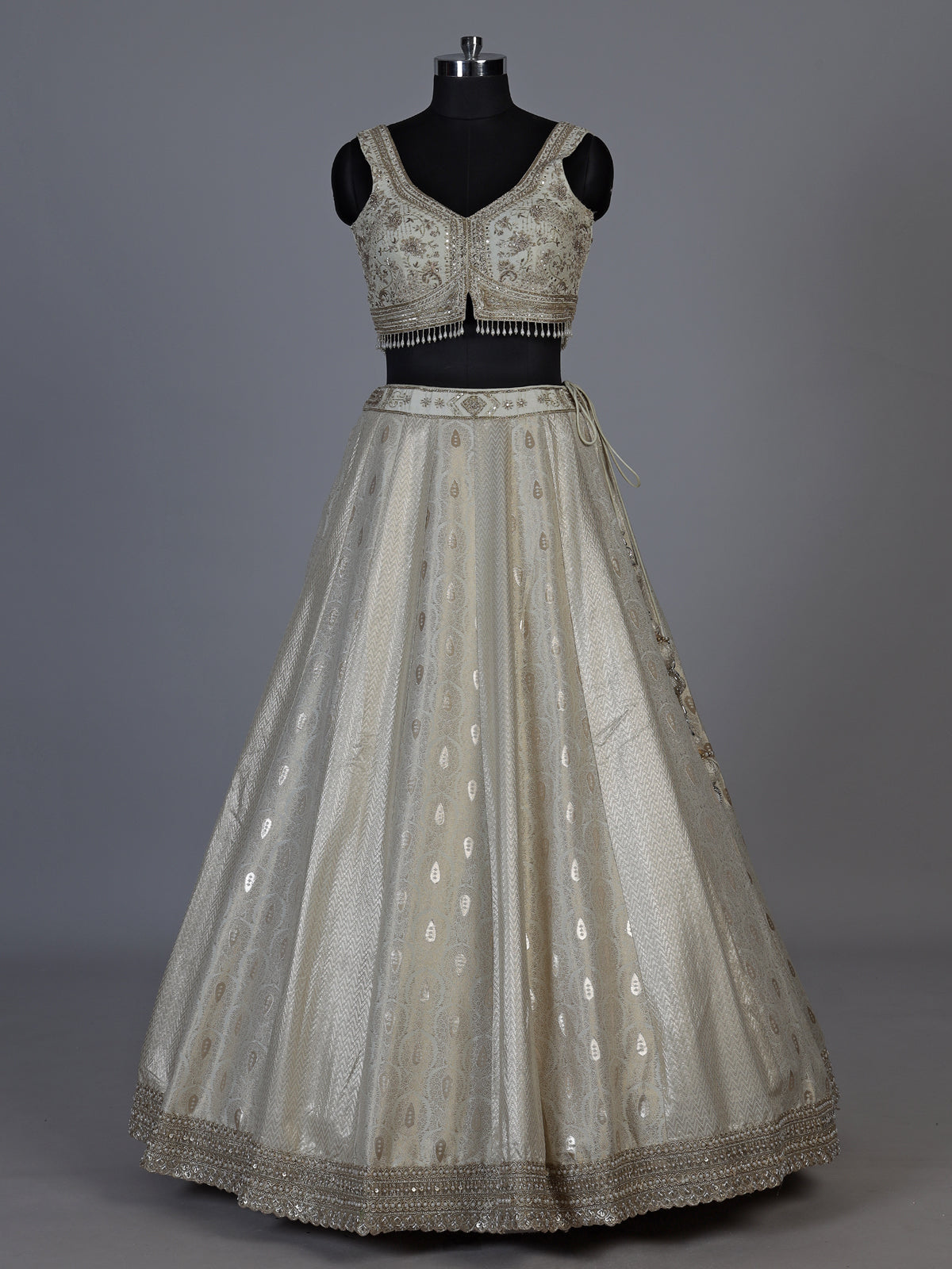 Cream jacquard brocade lehenga choli with lavish embellishments