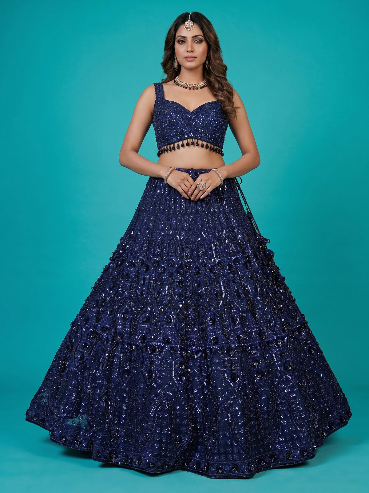 Blue net lehenga choli with intricate pearl cutdana embellishments