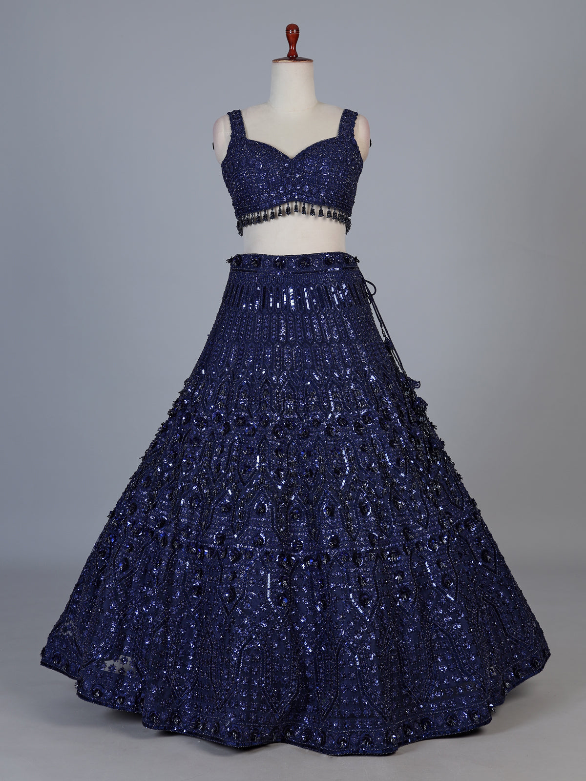 Blue net lehenga choli with intricate pearl cutdana embellishments