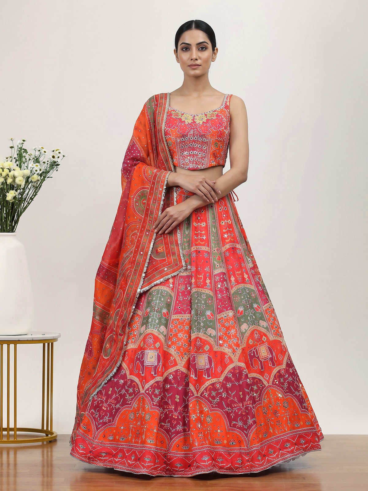Orange art silk lehenga choli with elephant motif embellishments