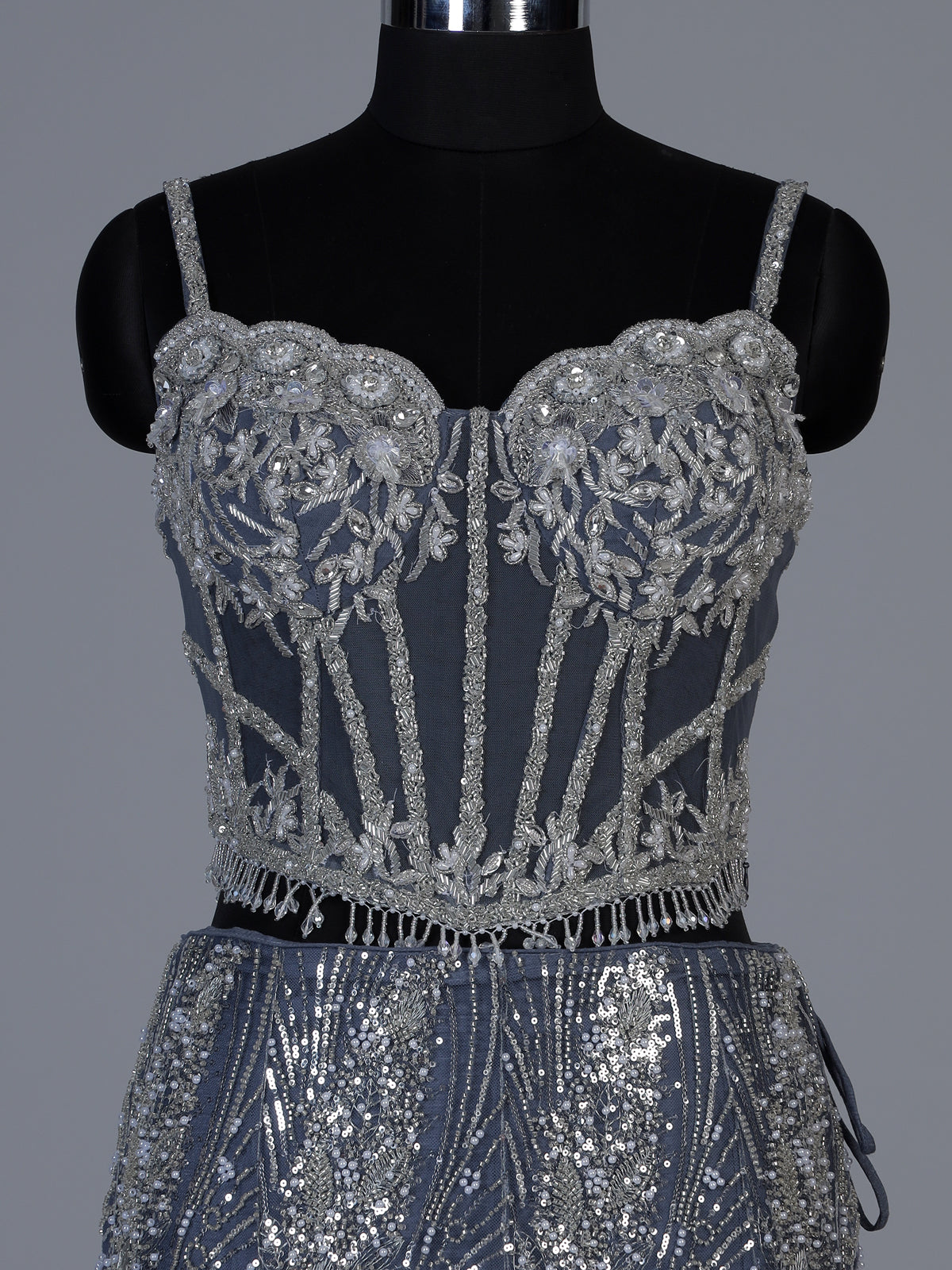 Stone grey net lehenga choli with zardosi stone embellishments