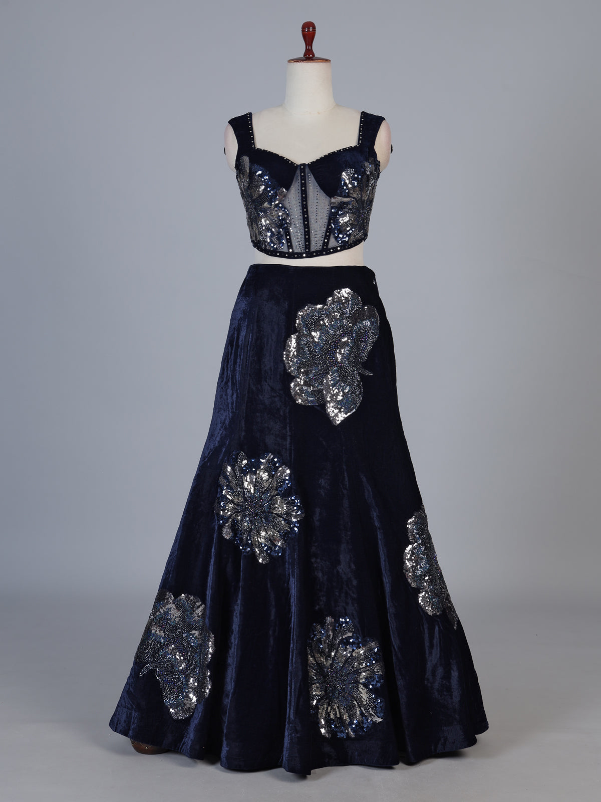 Blue velvet lehenga choli with cutdana and pearl embellishments