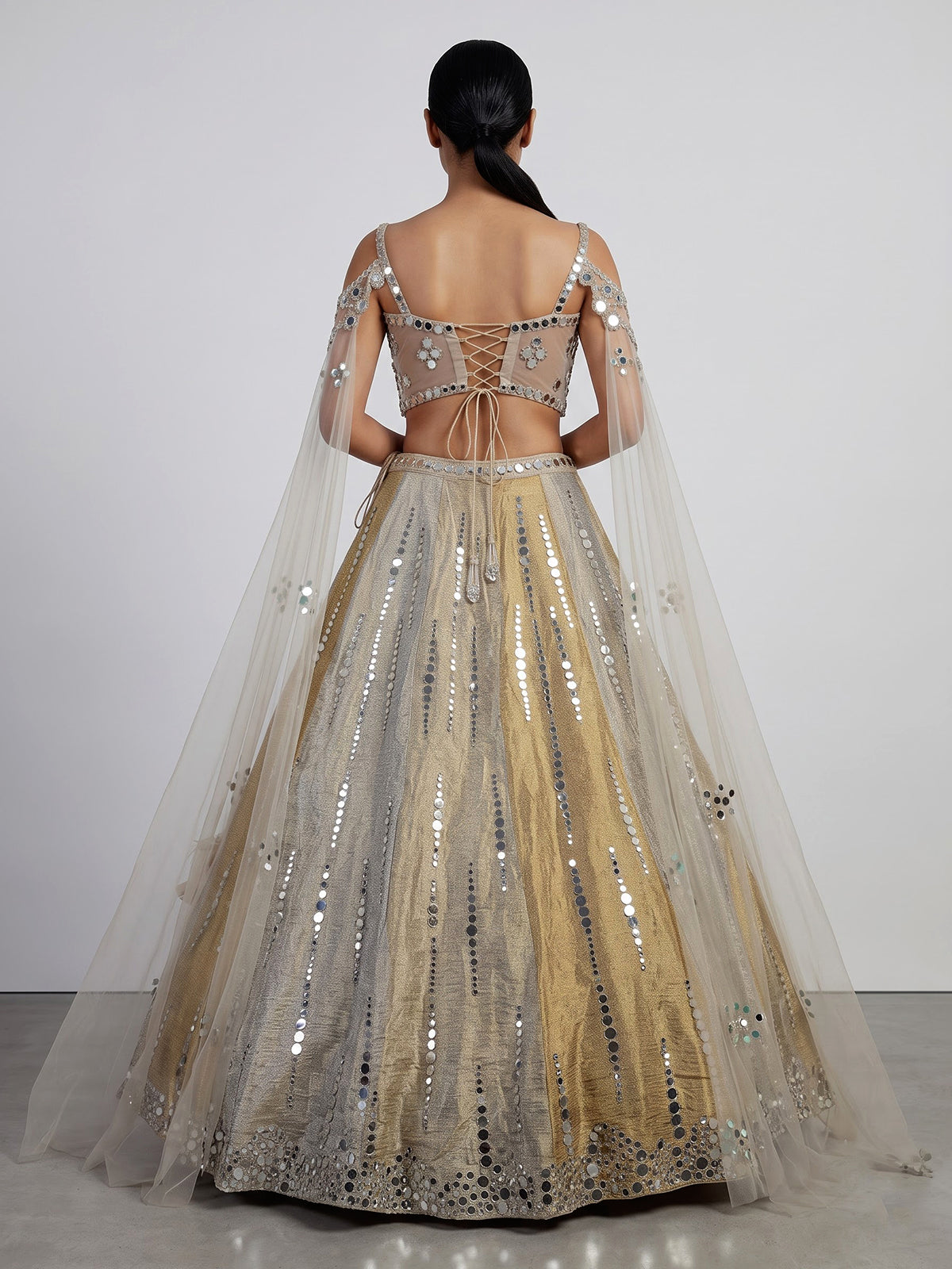 Golden tissue blend lehenga choli with mirror cutdana embellishments