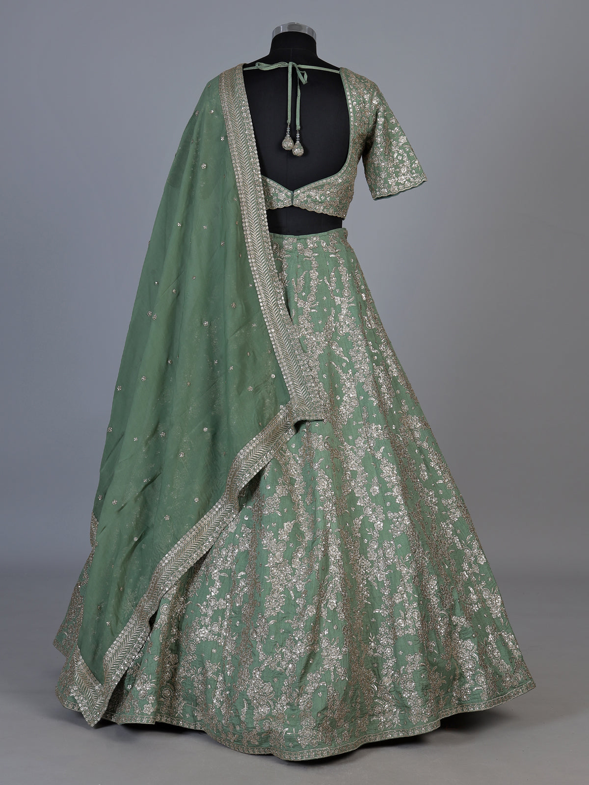 Pista green silk lehenga choli with resham floral embellishments