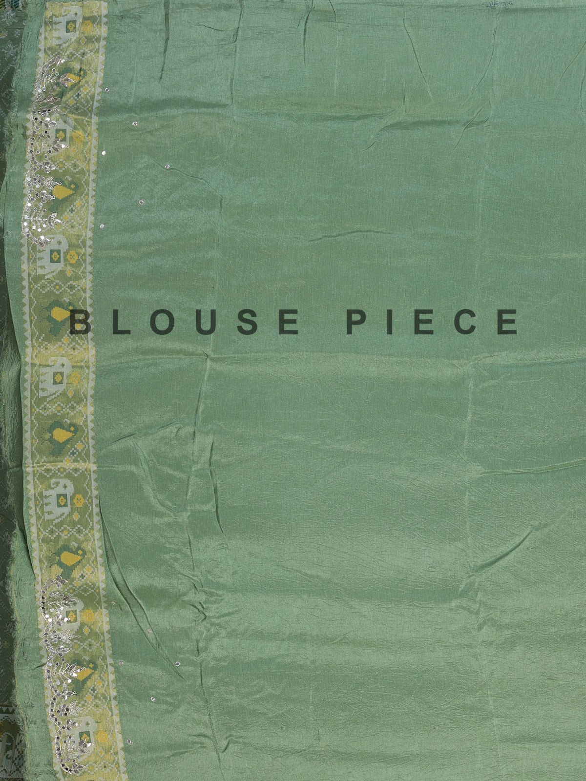 Pista green soft silk saree with charming patola printed artistry